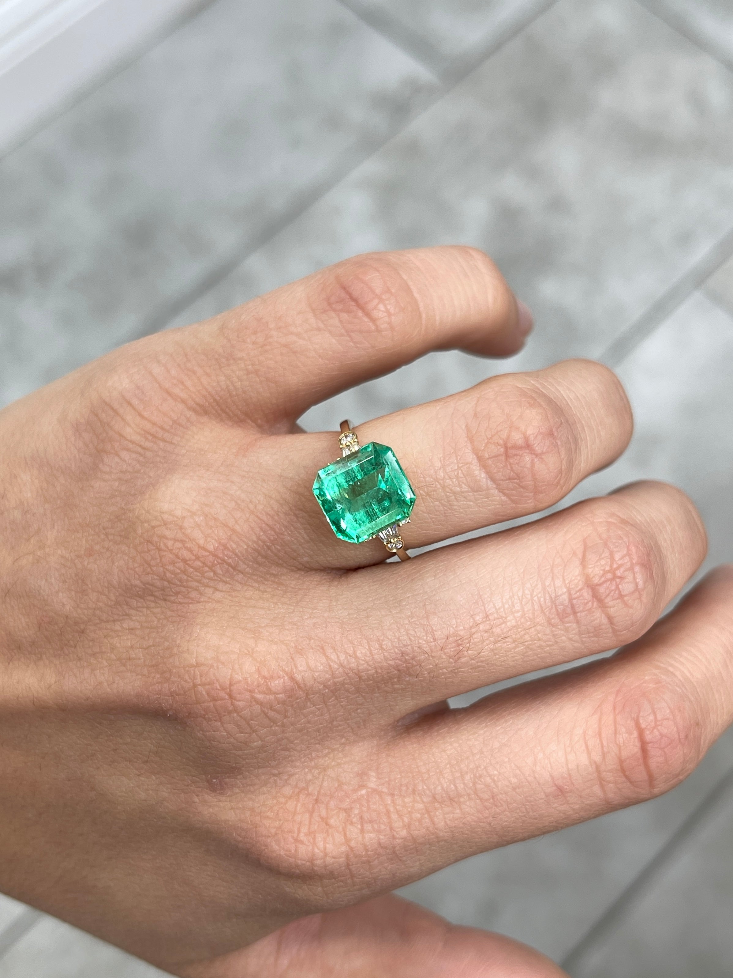 Yellowish green 6.07 carat natural Colombian emerald loose Asscher cut gemstone showcasing clarity and vibrant color.