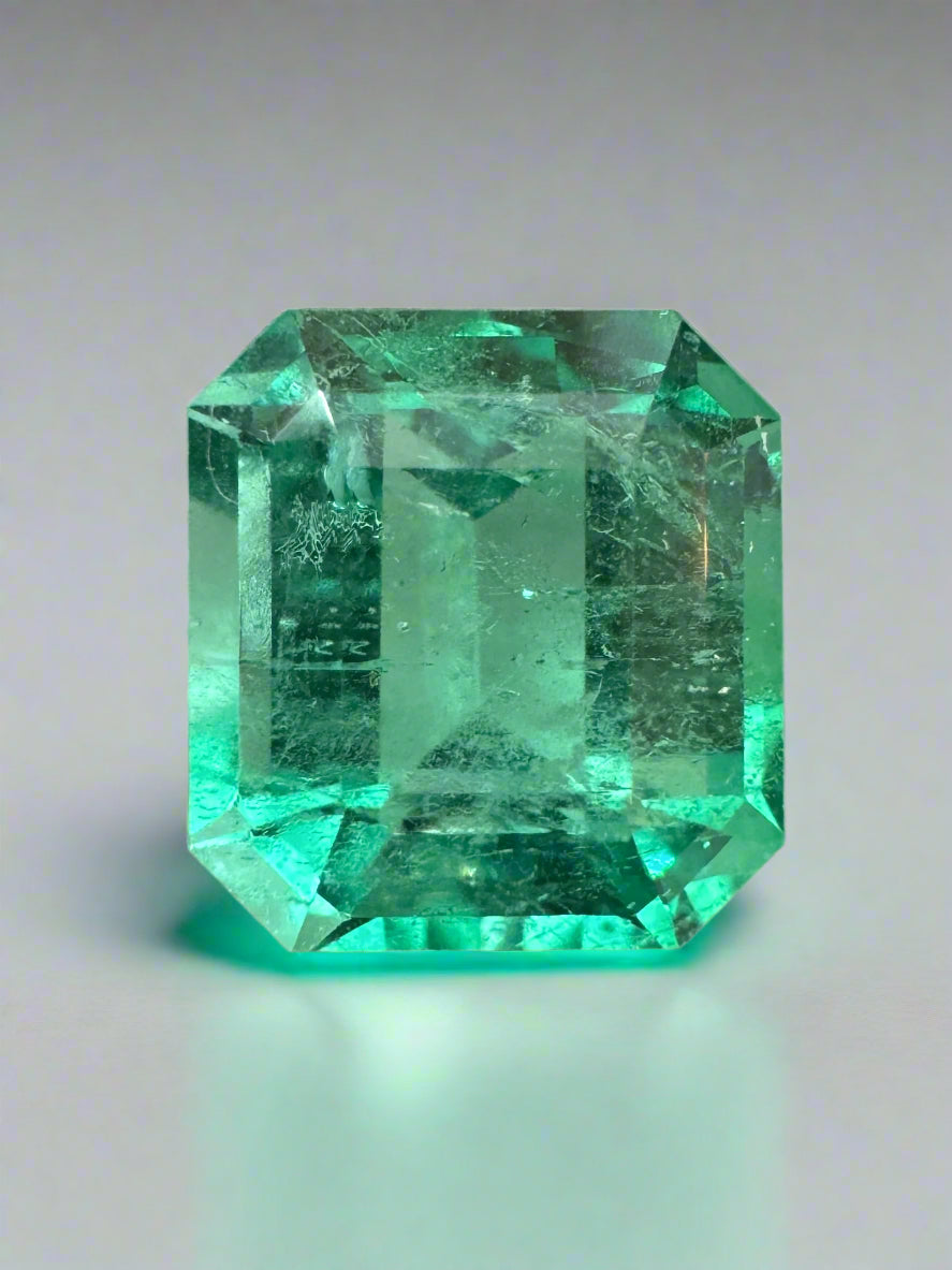 6.07 carat yellowish green natural Colombian emerald loose gemstone in Asscher cut, displayed by JR Colombian Emeralds
