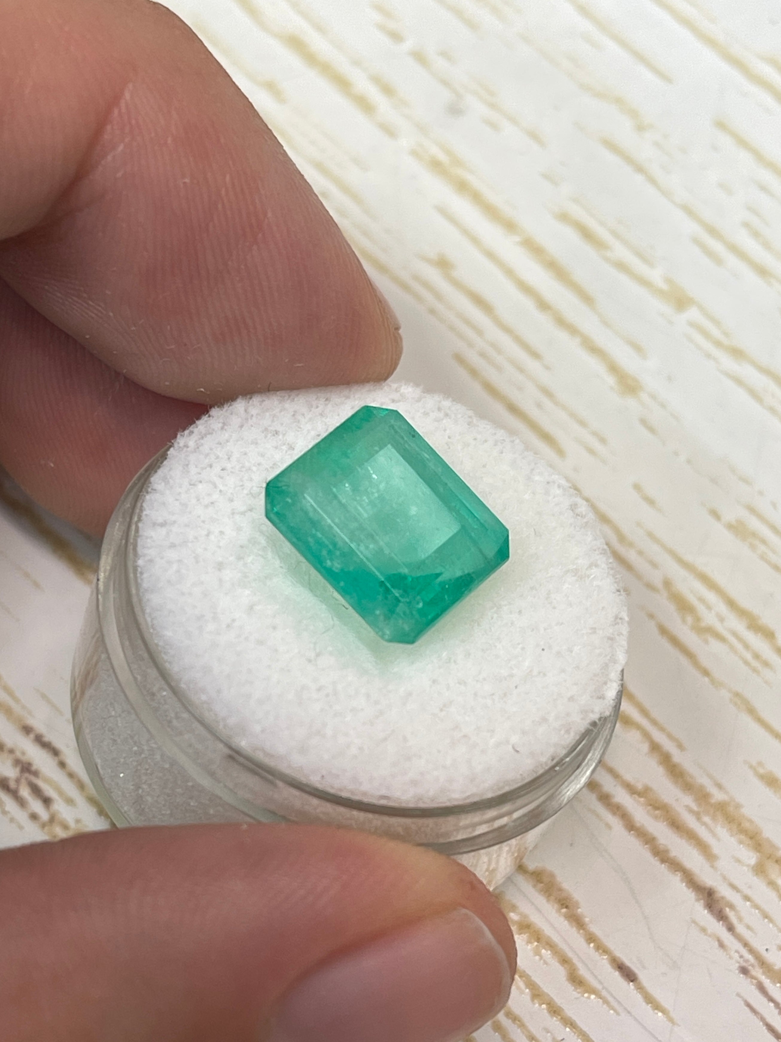 Natural loose Colombian emerald, 6.13 carats, earthy pastel green, emerald cut, from JR Colombian Emeralds.
