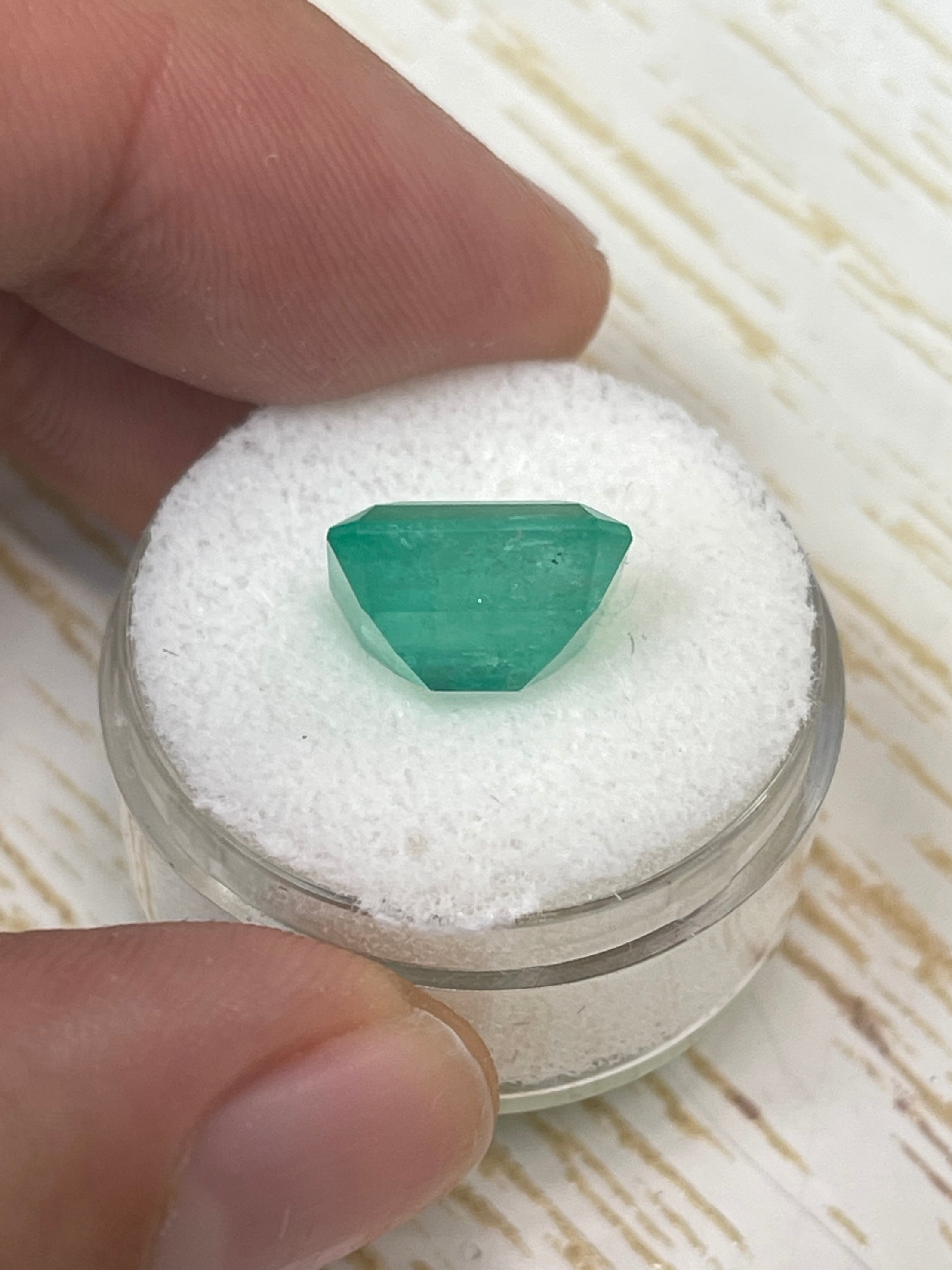 6.13-carat natural Colombian emerald loose gemstone, emerald cut, earthy pastel green color, from JR Colombian Emeralds.