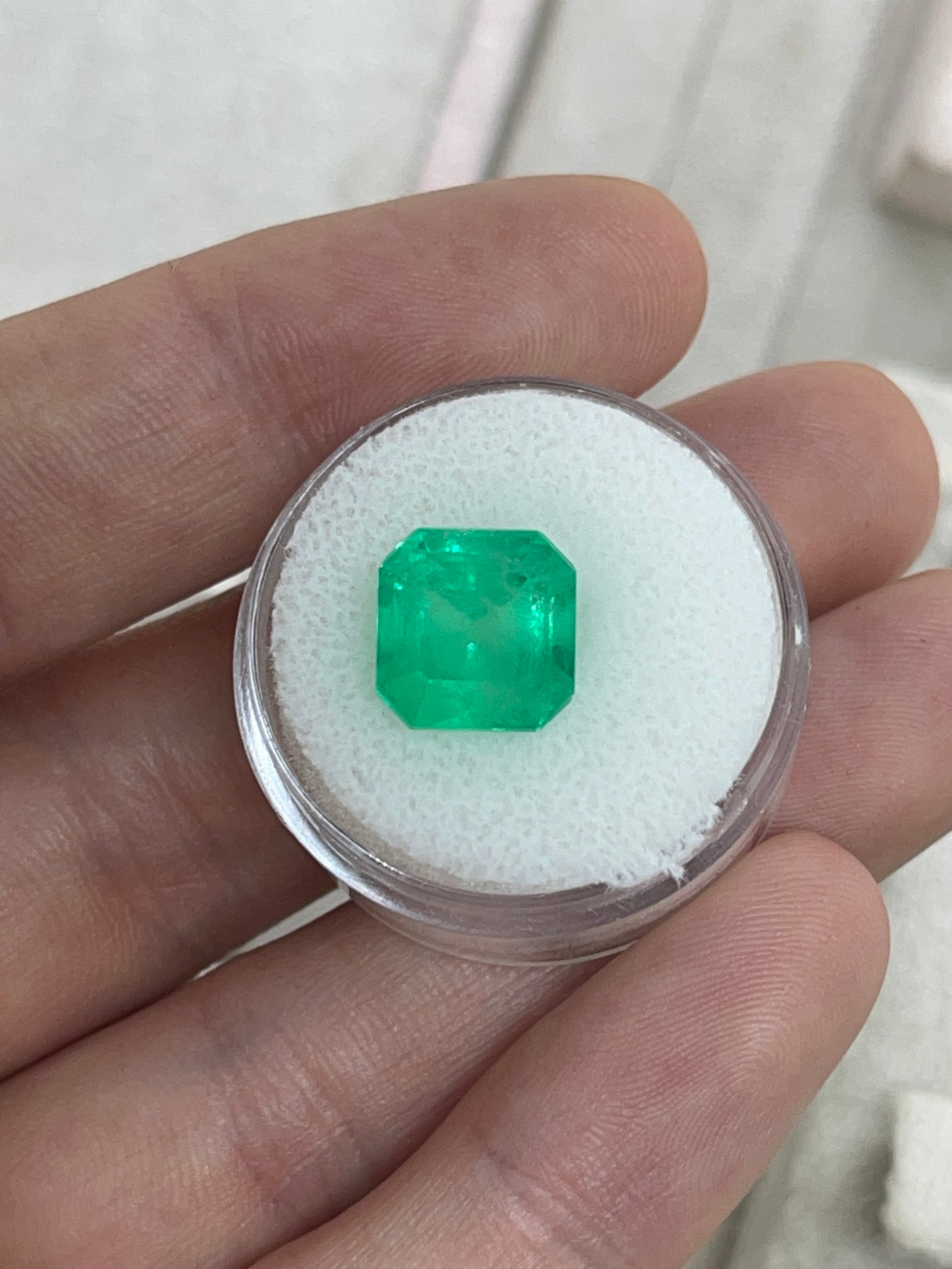 Medium neon yellowish Colombian emerald, 6.19 carats, 10x10 mm Asscher cut, loose gemstone from JR Colombian Emeralds.