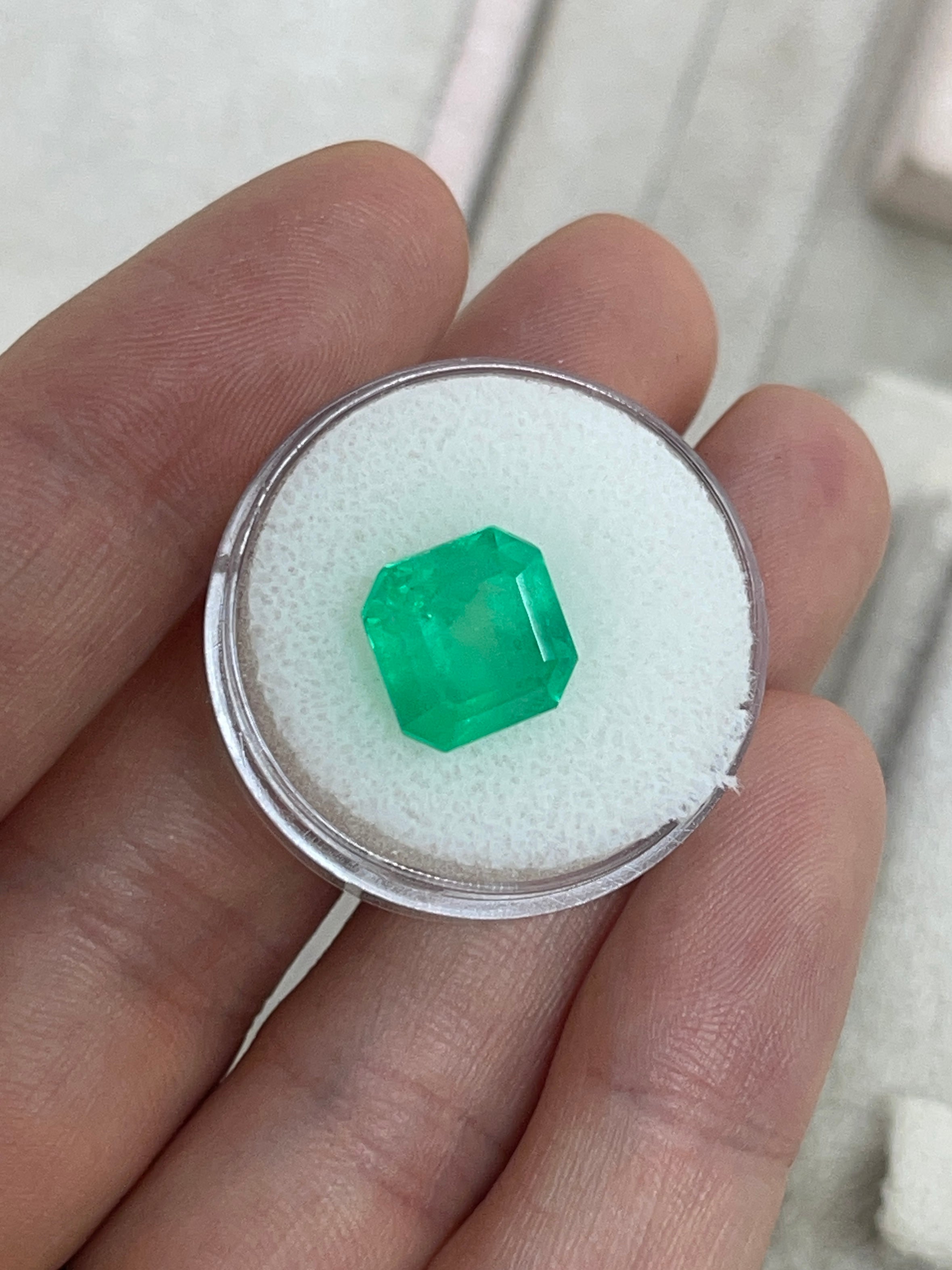 Medium neon yellowish Colombian emerald, 6.19 carats, 10x10 mm Asscher cut, loose gemstone from JR Colombian Emeralds.