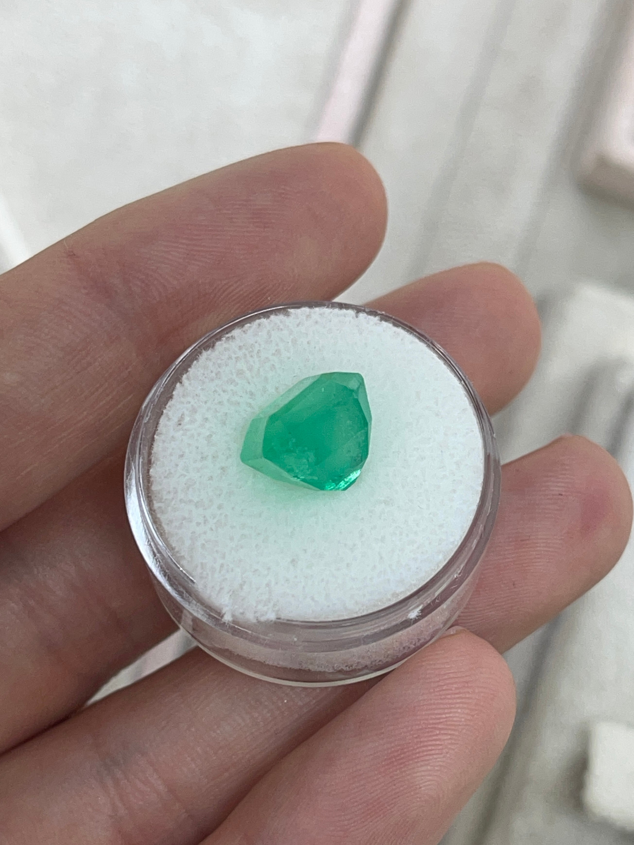 Medium neon yellowish Colombian emerald in 10x10 Asscher cut, loose gemstone with 6.19 carats from JR Colombian Emeralds.