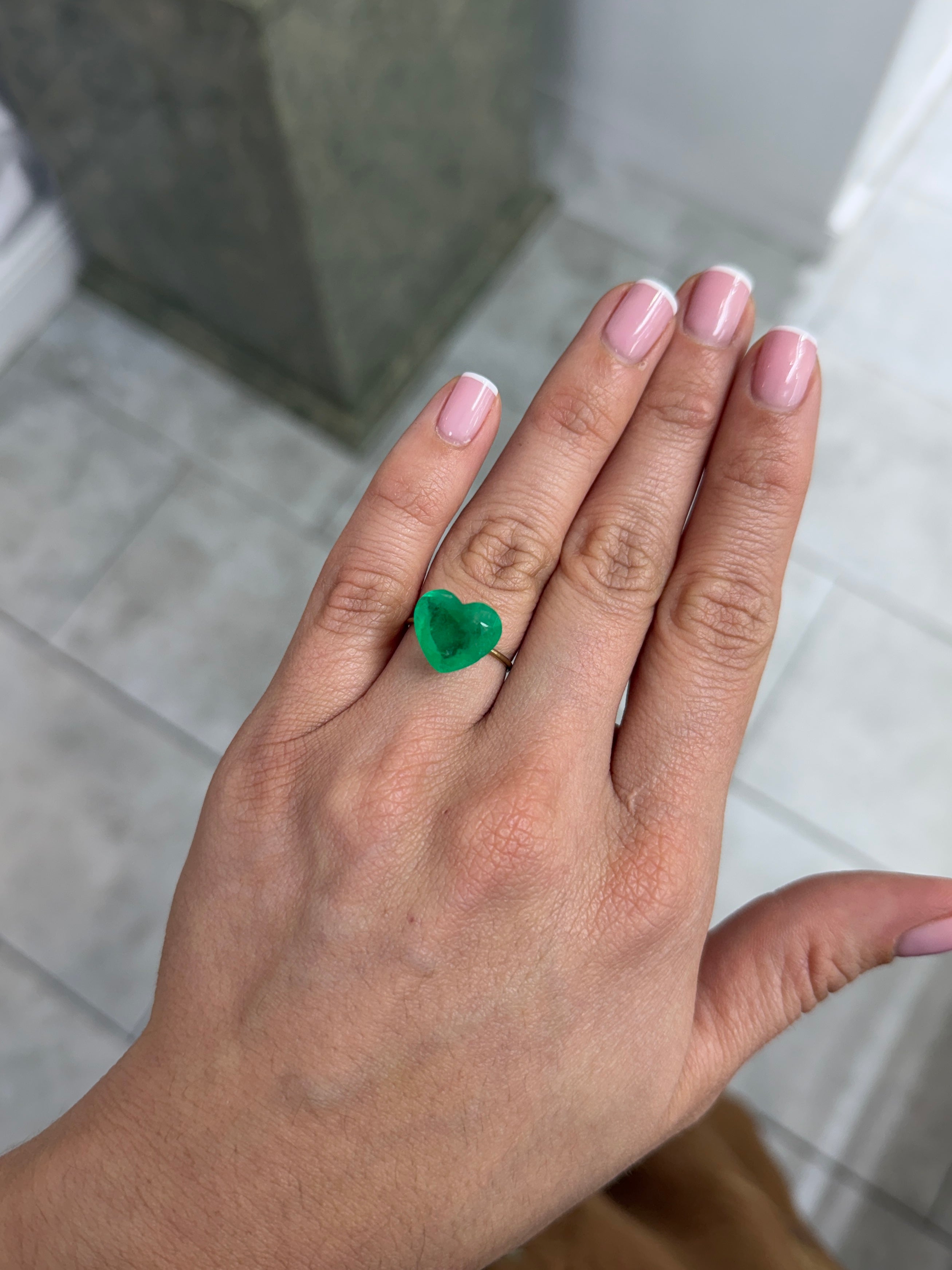 Medium green 6.35 carat Colombian emerald loose heart cut gemstone from JR Colombian Emeralds, showcasing vibrant color and clarity.