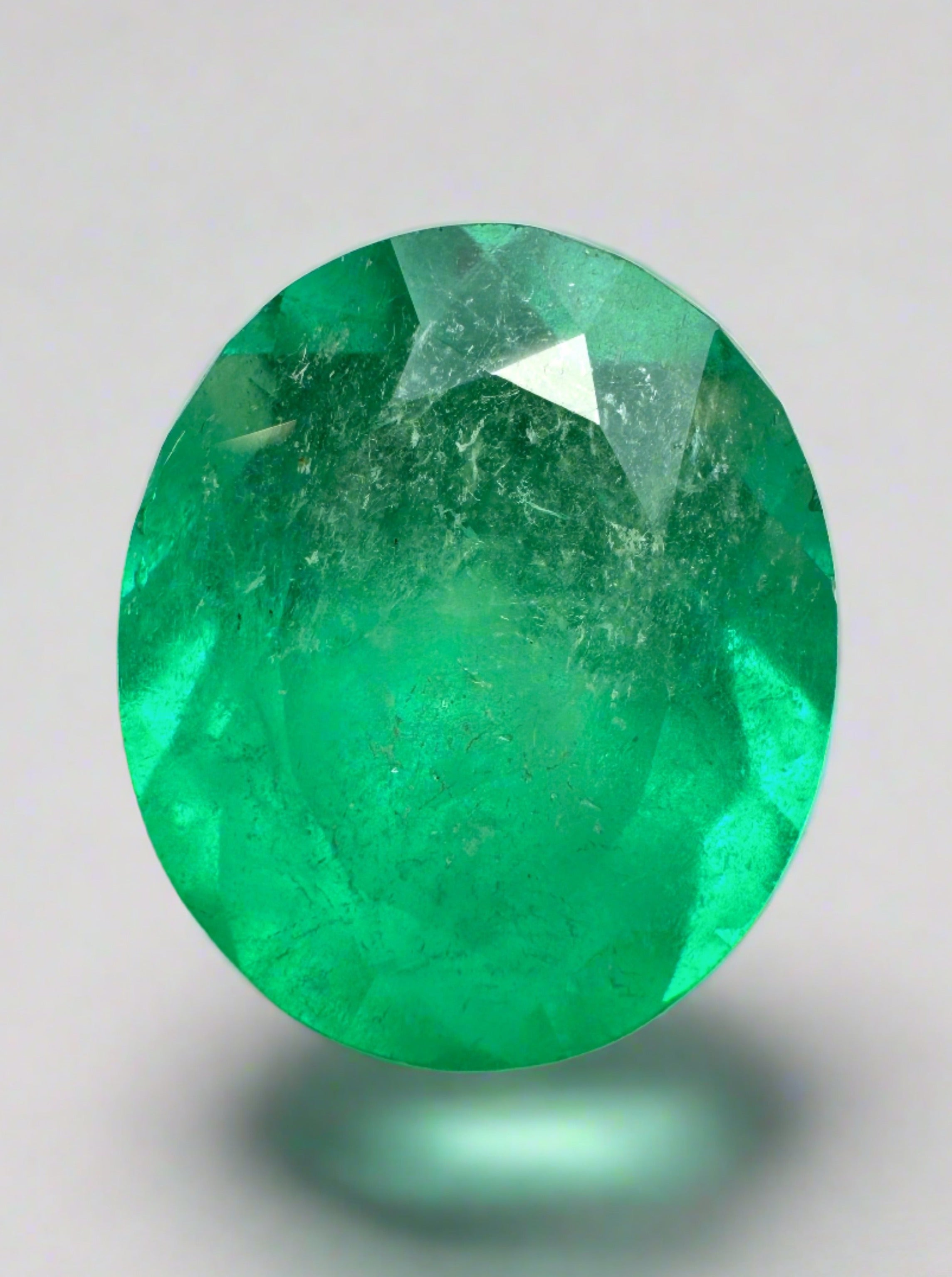 Oval cut neon green Colombian emerald, 6.35 carats, natural loose gemstone from JR Colombian Emeralds.