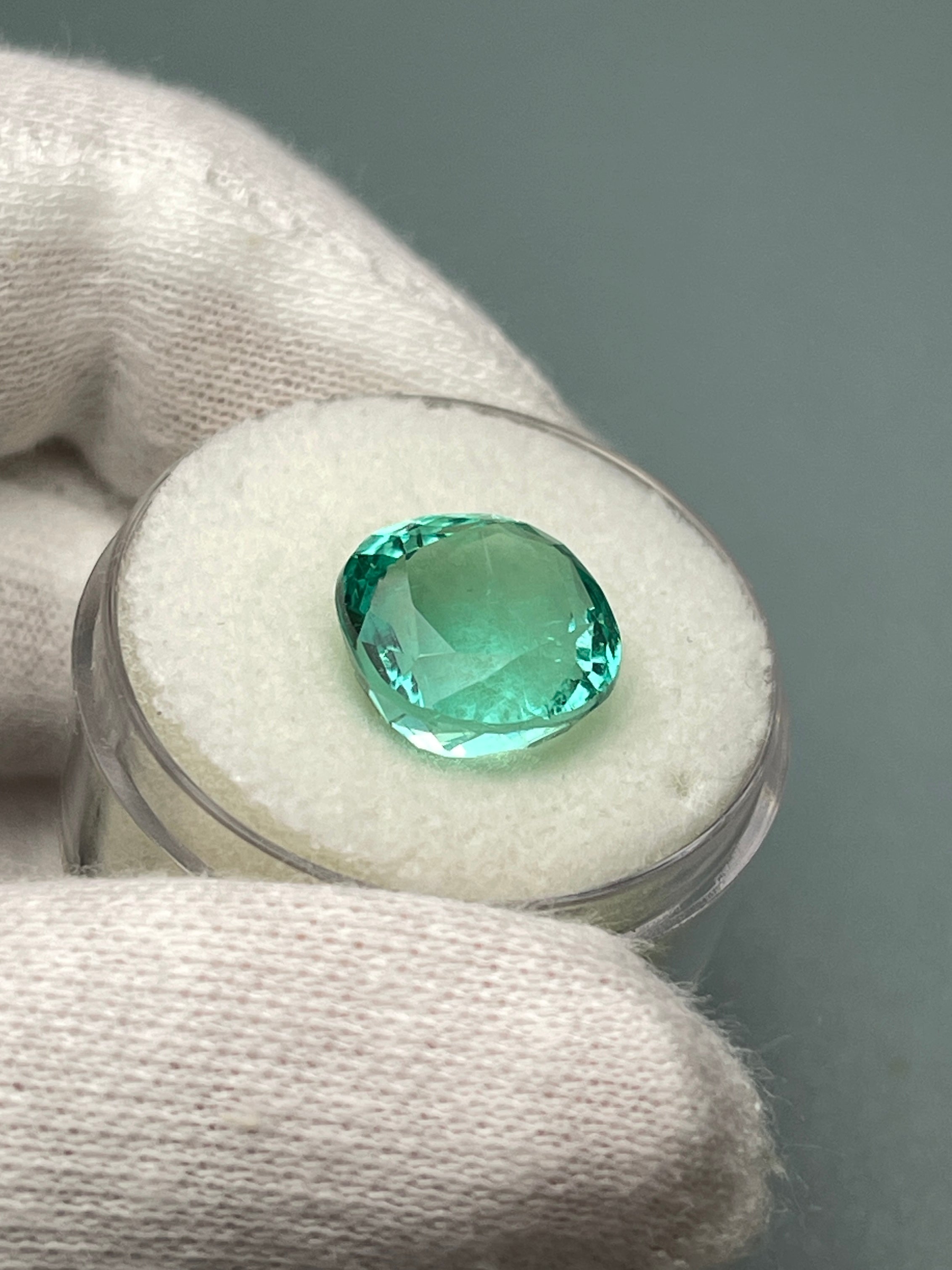 Luminous bluish-green 6.38 carat Colombian emerald in cushion cut, natural loose gemstone from JR Colombian Emeralds.