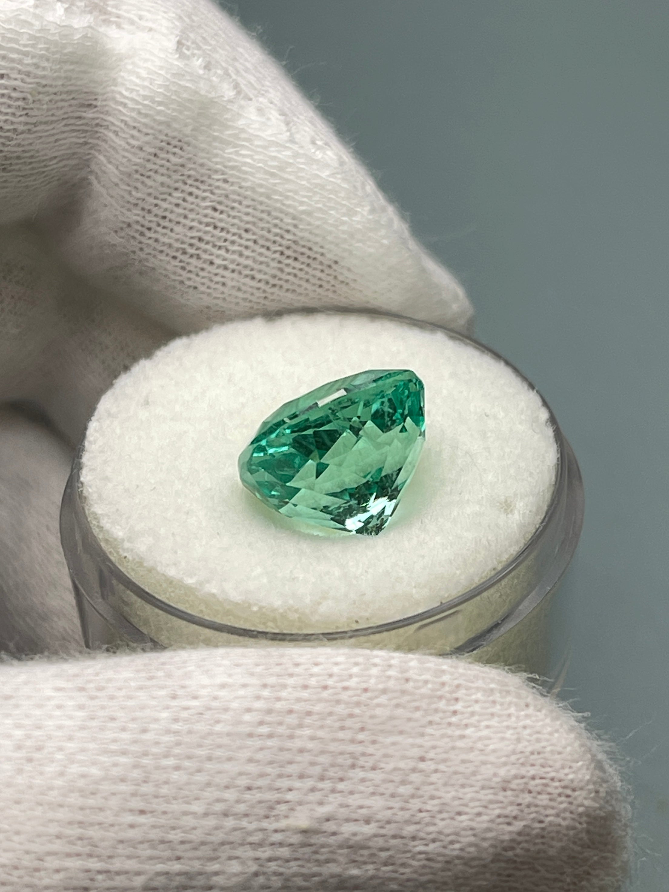 Luminous bluish green 6.38 carat natural Colombian emerald in cushion cut, loose gemstone from JR Colombian Emeralds.