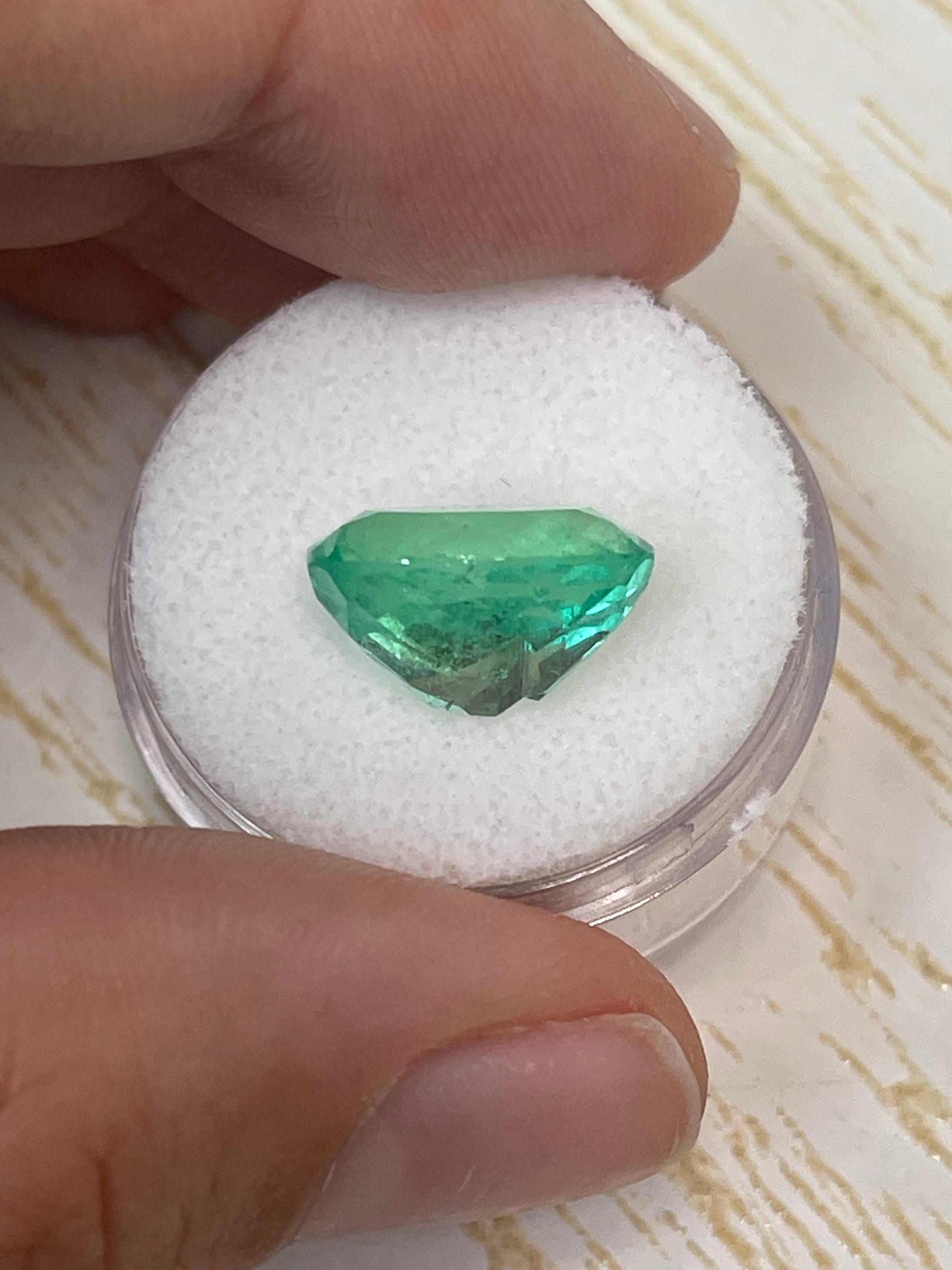 Medium green 6.40 carat oval-cut natural Colombian emerald loose gemstone with vibrant color and clarity, from JR Colombian Emeralds.
