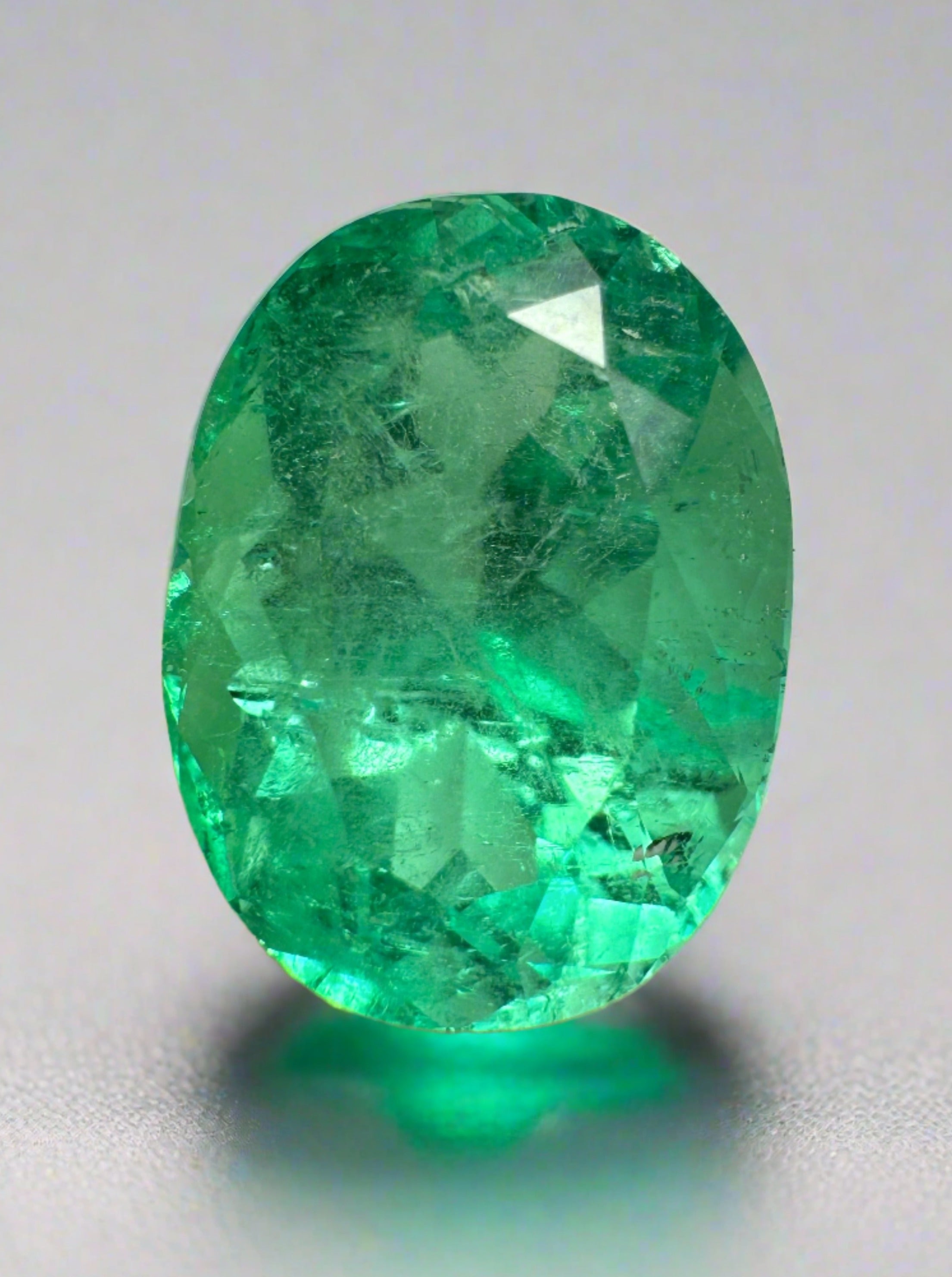 Medium green 6.40 carat natural Colombian emerald loose oval cut gemstone by JR Colombian Emeralds.