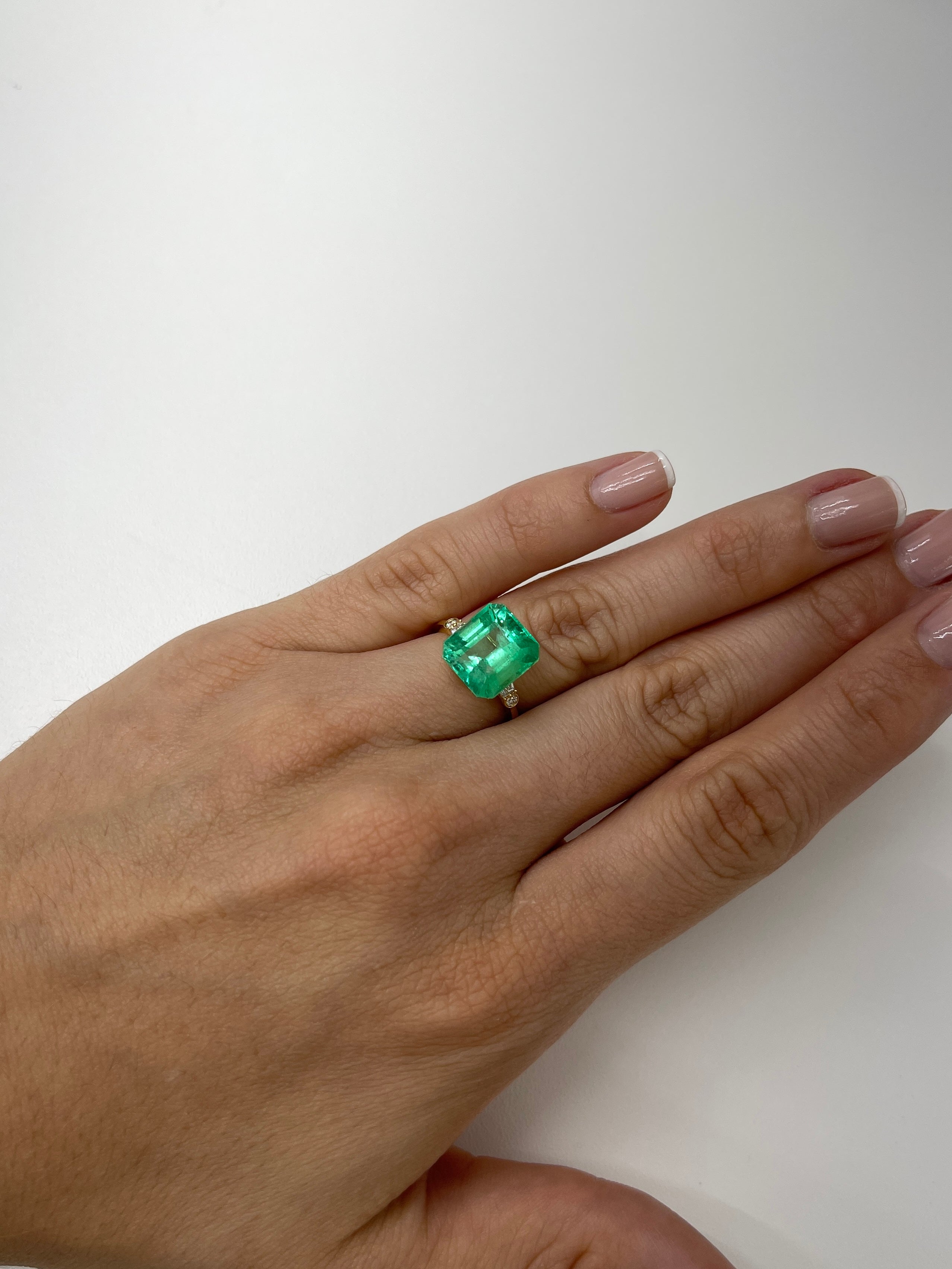 6.50 carat yellowish green natural Colombian emerald loose Asscher cut gemstone from JR Colombian Emeralds.