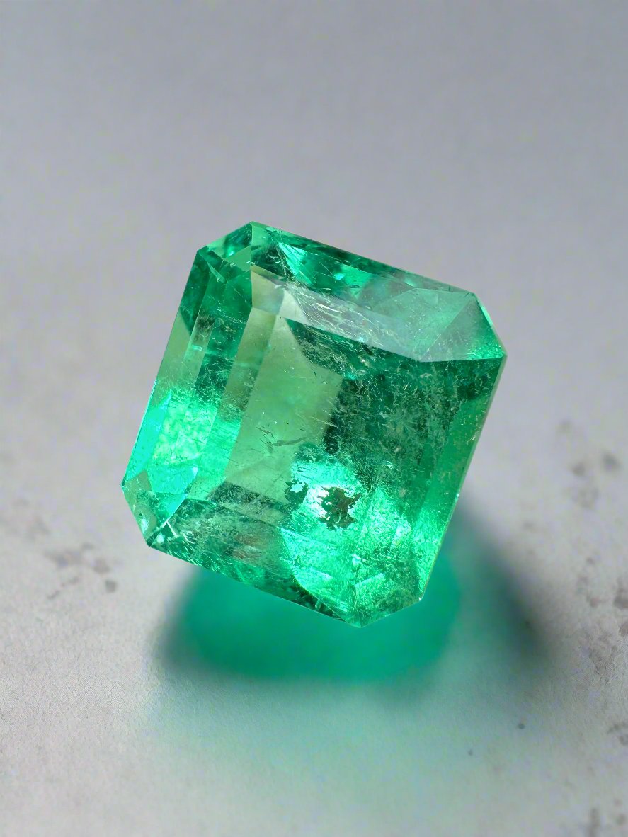 Yellowish green 6.50 carat natural Colombian emerald in Asscher cut, loose gemstone with vibrant color and clarity.