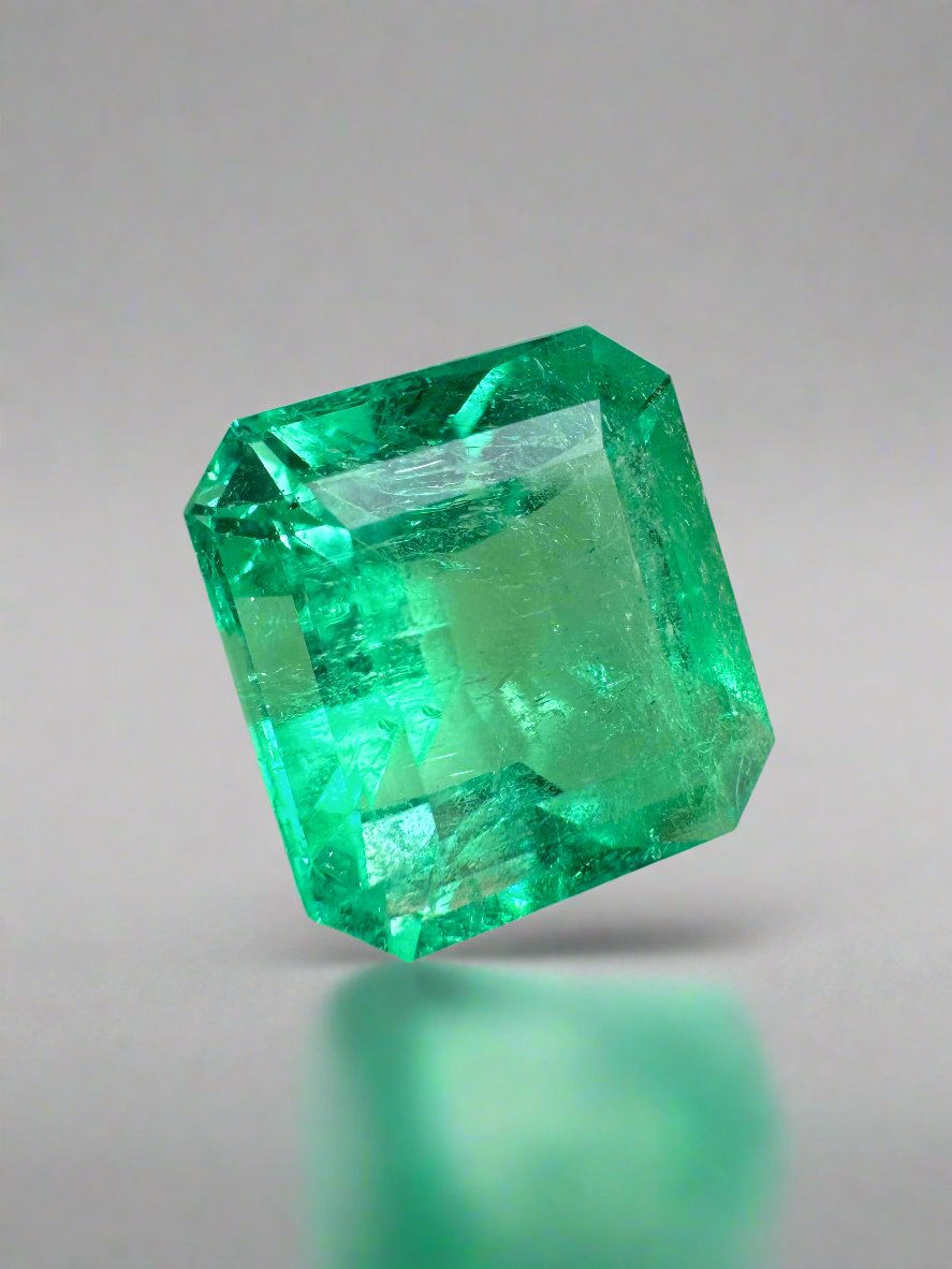 Yellowish green 6.50 carat natural Colombian emerald loose Asscher cut, showcasing vibrant color and clarity.