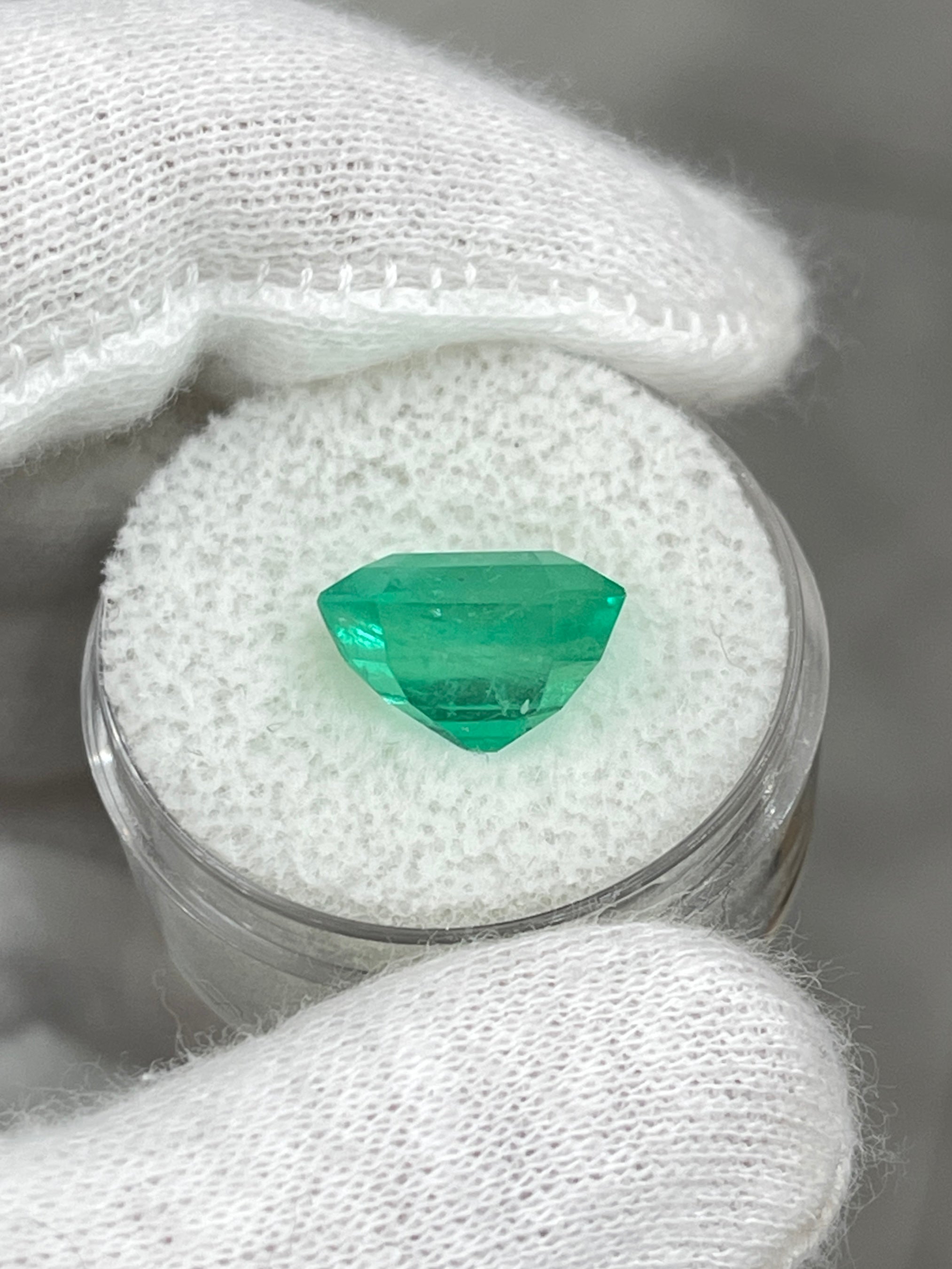 6.76 carat glowing green natural Colombian emerald loose Asscher cut gemstone, showcasing vibrant color and clarity.