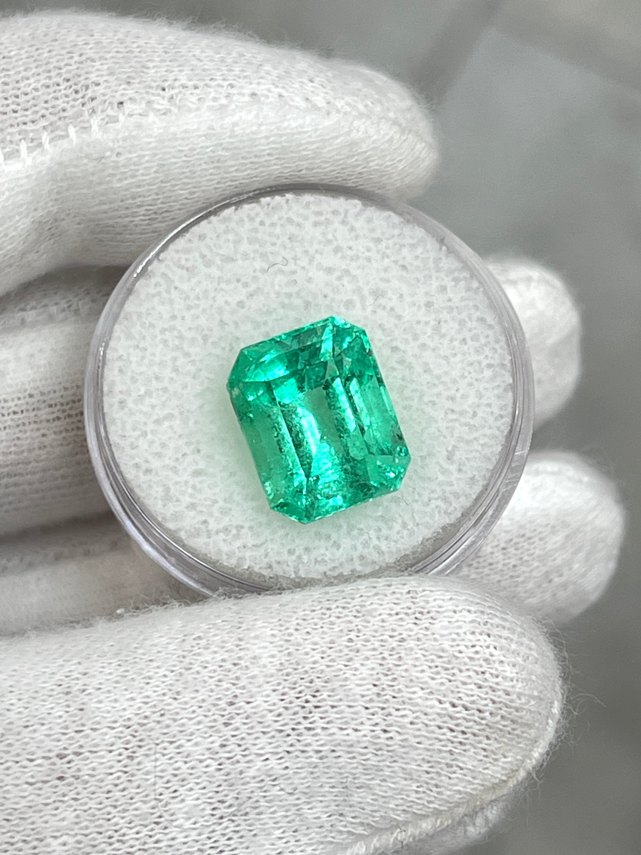 Luminous 6.79-carat natural Colombian emerald loose gemstone in classic emerald cut, ethically mined by JR Colombian Emeralds.