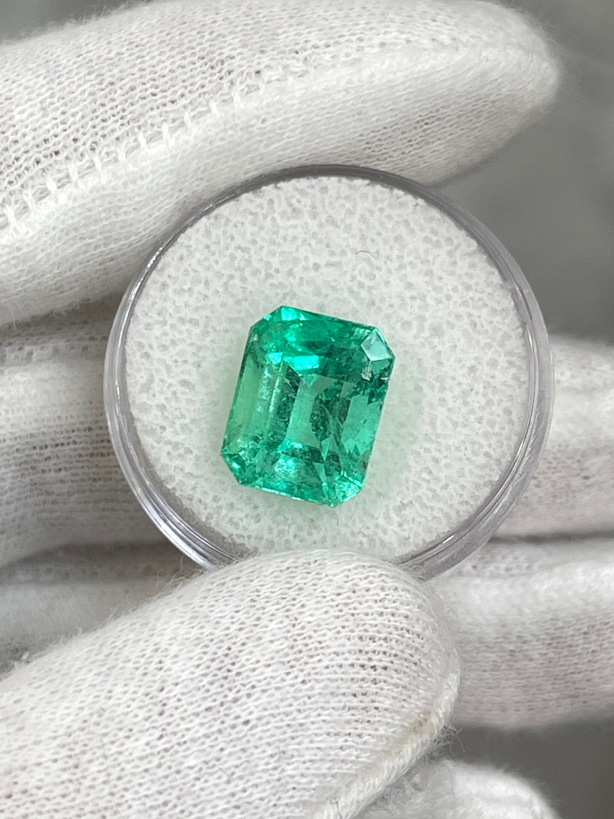 Luminous 6.79 Carat natural Colombian emerald loose gemstone in classic emerald cut, ethically mined by JR Colombian Emeralds.