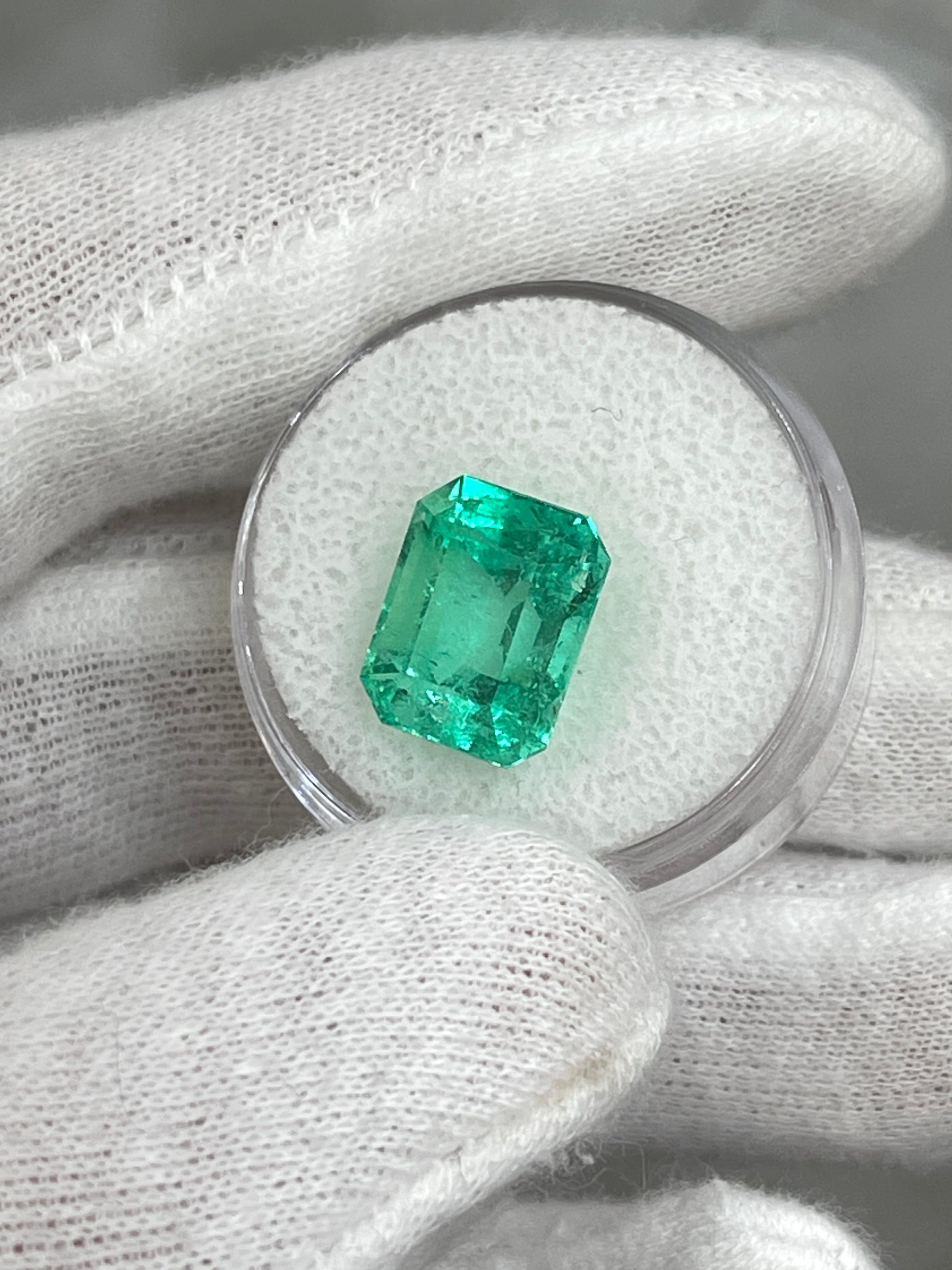 Luminous 6.79 carat natural Colombian emerald loose gemstone in classic emerald cut, ethically mined by JR Colombian Emeralds.