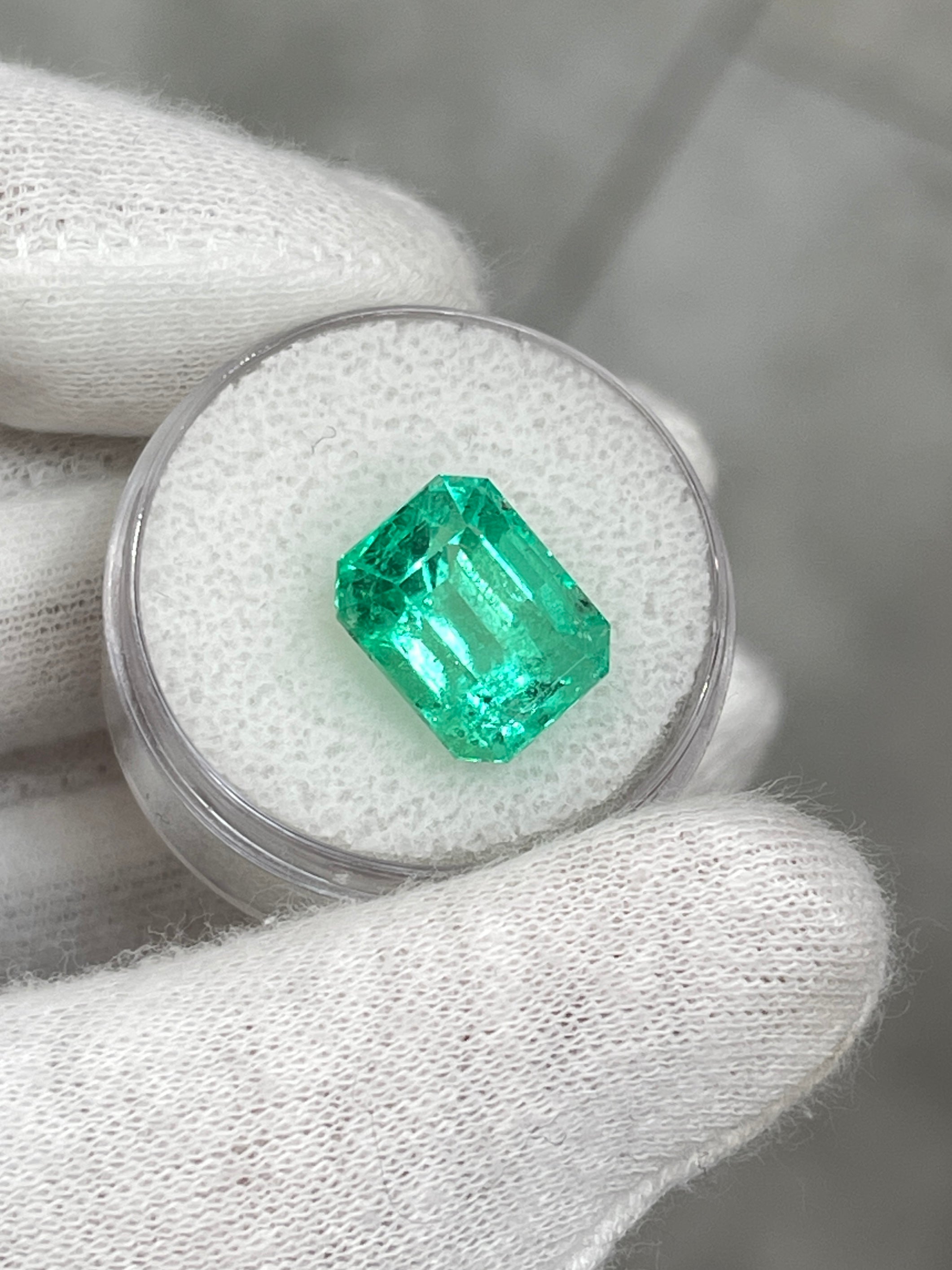 Luminous 6.79 carat natural Colombian emerald loose gemstone in classic emerald cut, ethically mined by JR Colombian Emeralds.