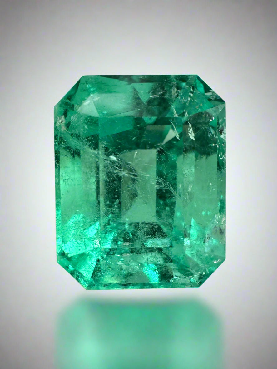 Luminous 6.79-carat natural Colombian emerald in classic emerald cut, ethically mined, set in a jewelry setting.