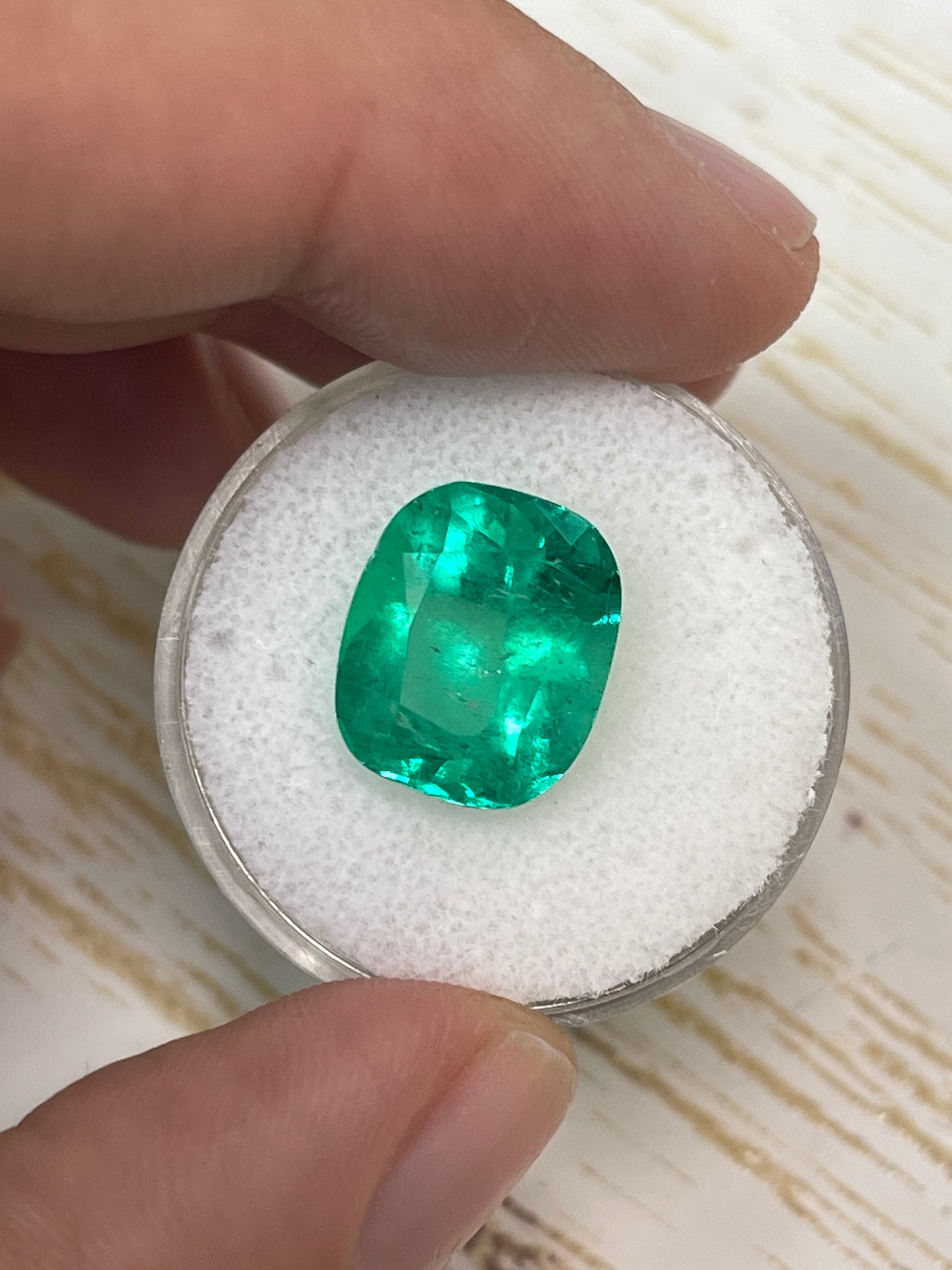 7.08 carat Muzo green Colombian emerald loose cushion cut gem from JR Colombian Emeralds, natural and vibrant green gemstone.