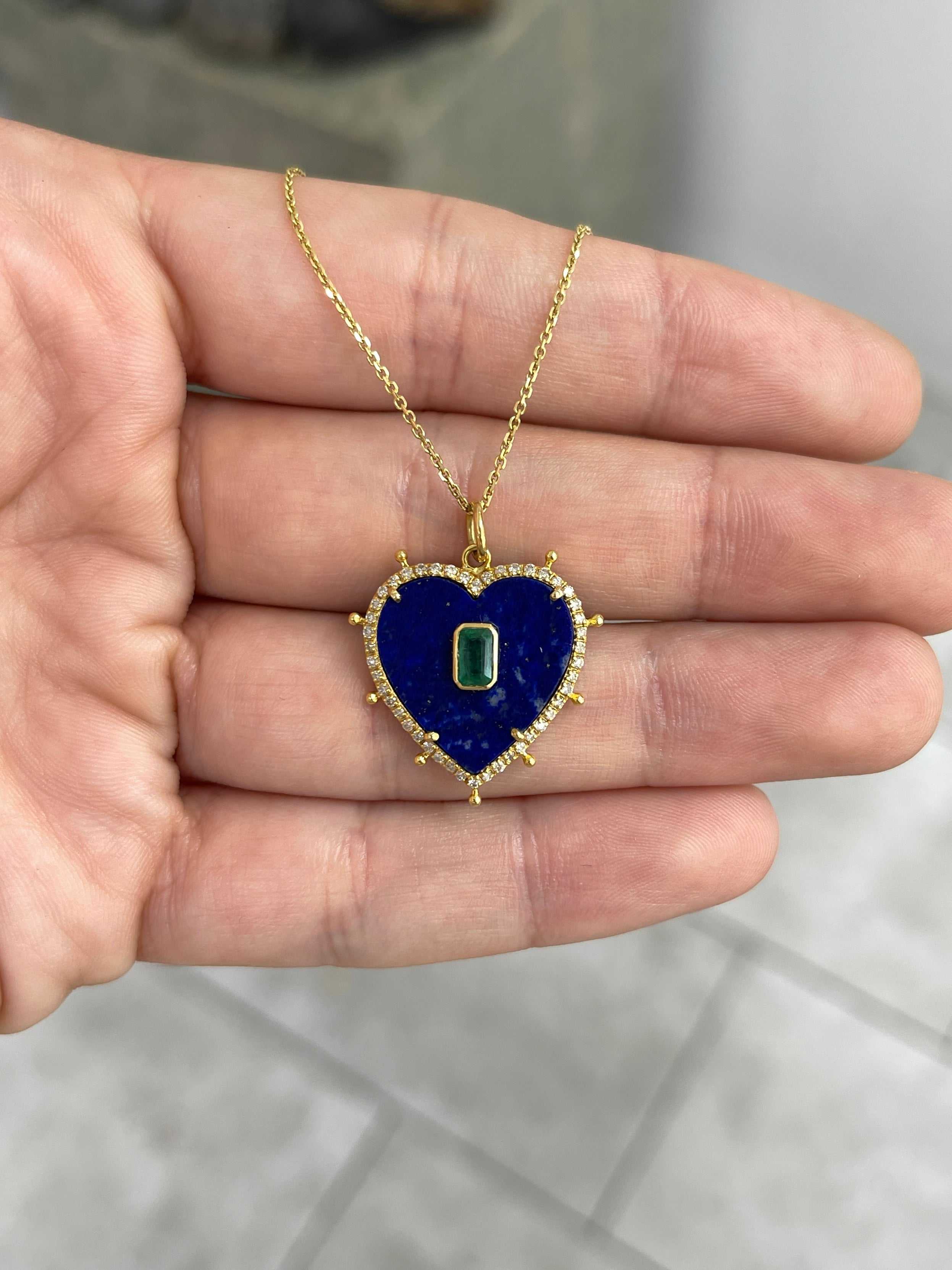 14K gold heart pendant featuring natural lapis, emerald, and diamond stones, showcased with intricate details and vibrant colors.