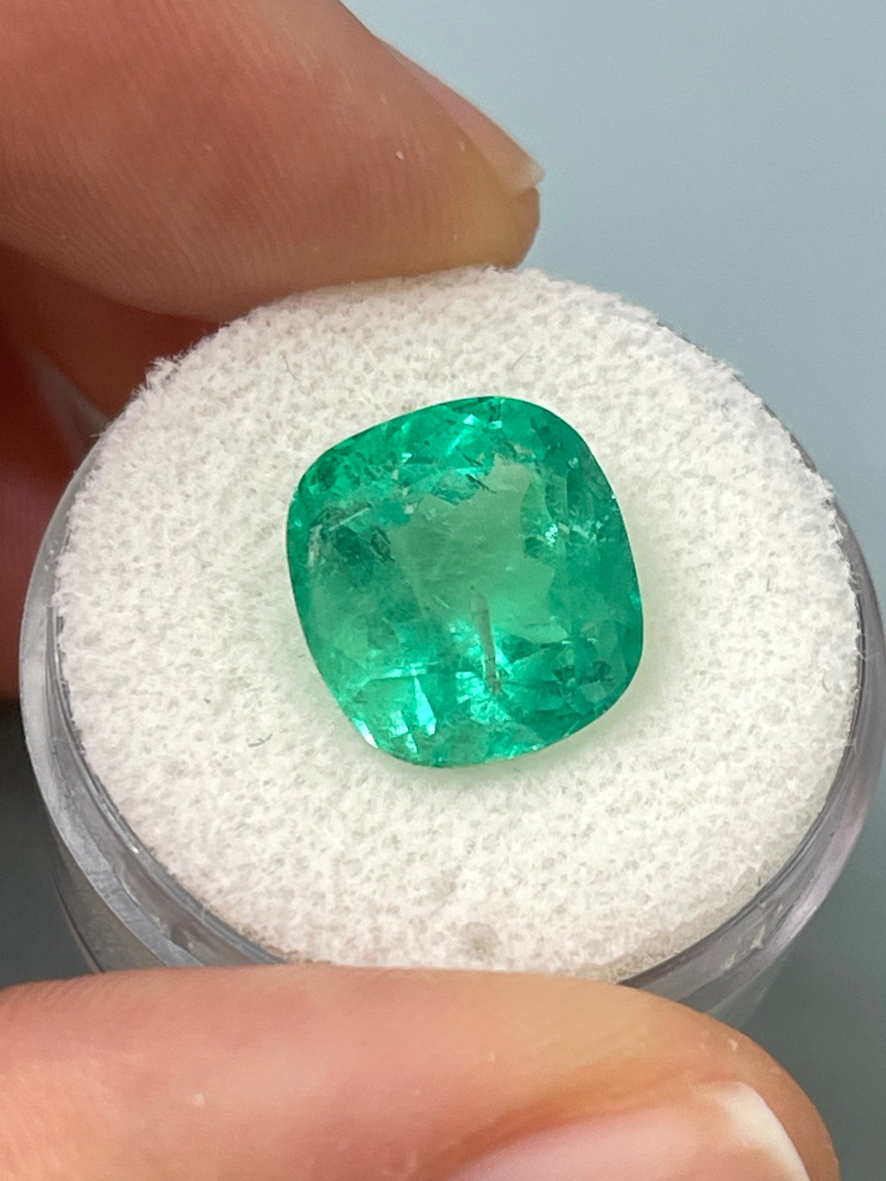 Medium bluish green 7.28 carat Colombian emerald loose cushion cut gemstone by JR Colombian Emeralds.