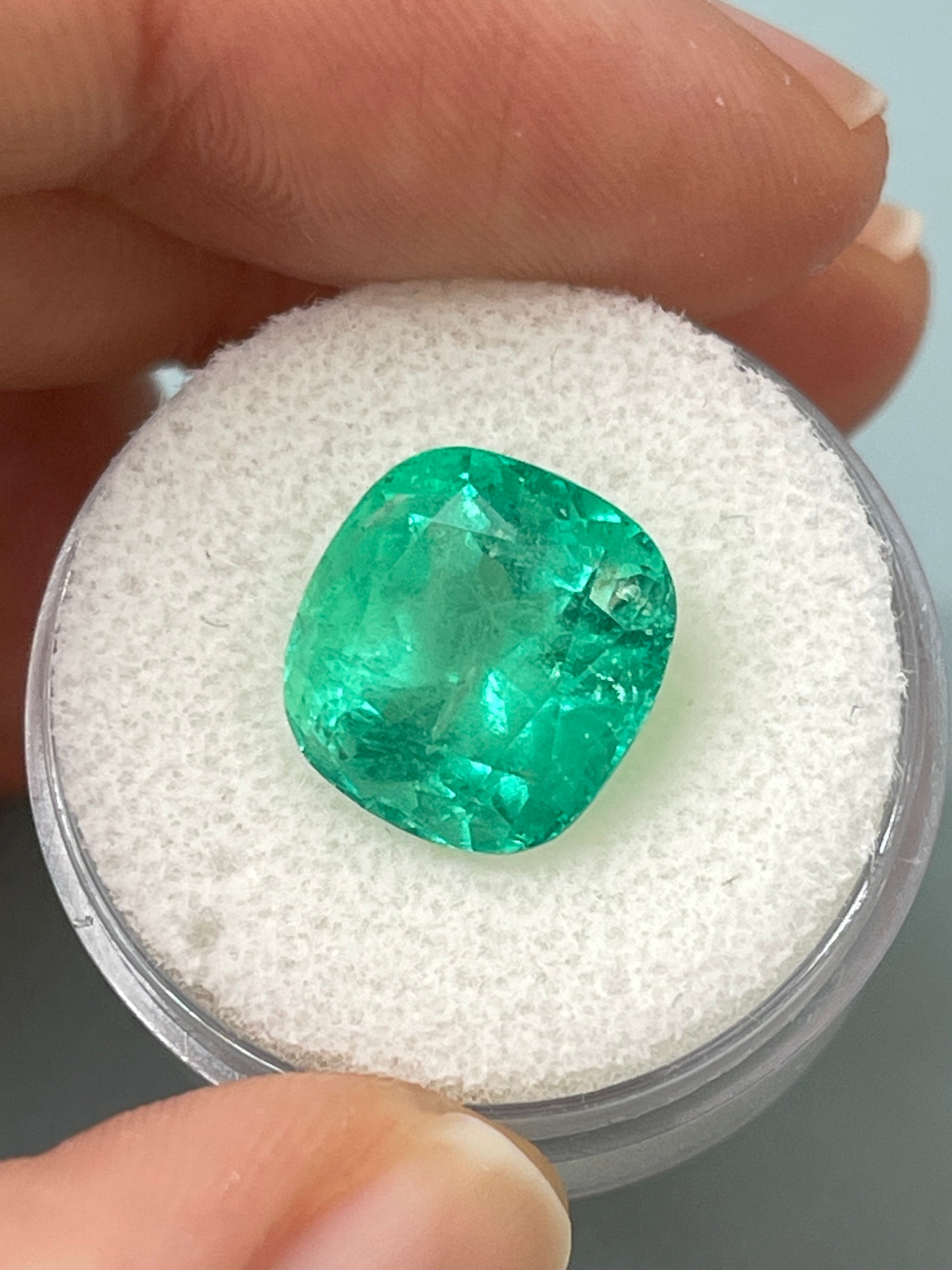 7.28 carat medium bluish green natural Colombian emerald loose cushion cut gemstone from JR Colombian Emeralds.