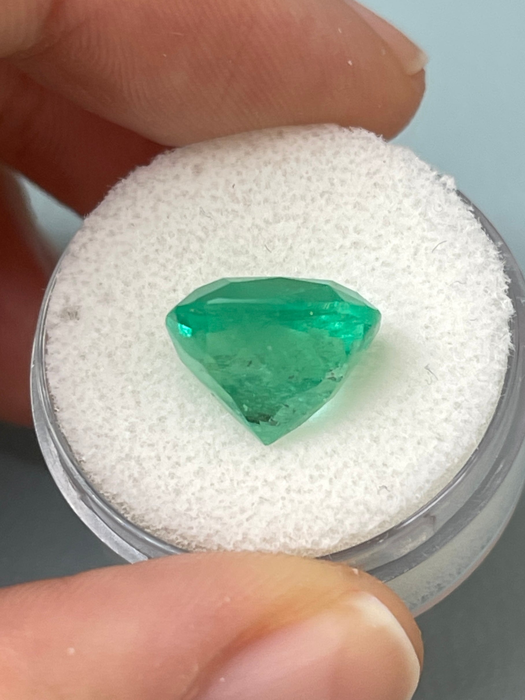Medium bluish green 7.28 carat Colombian emerald loose cushion cut gemstone from JR Colombian Emeralds.