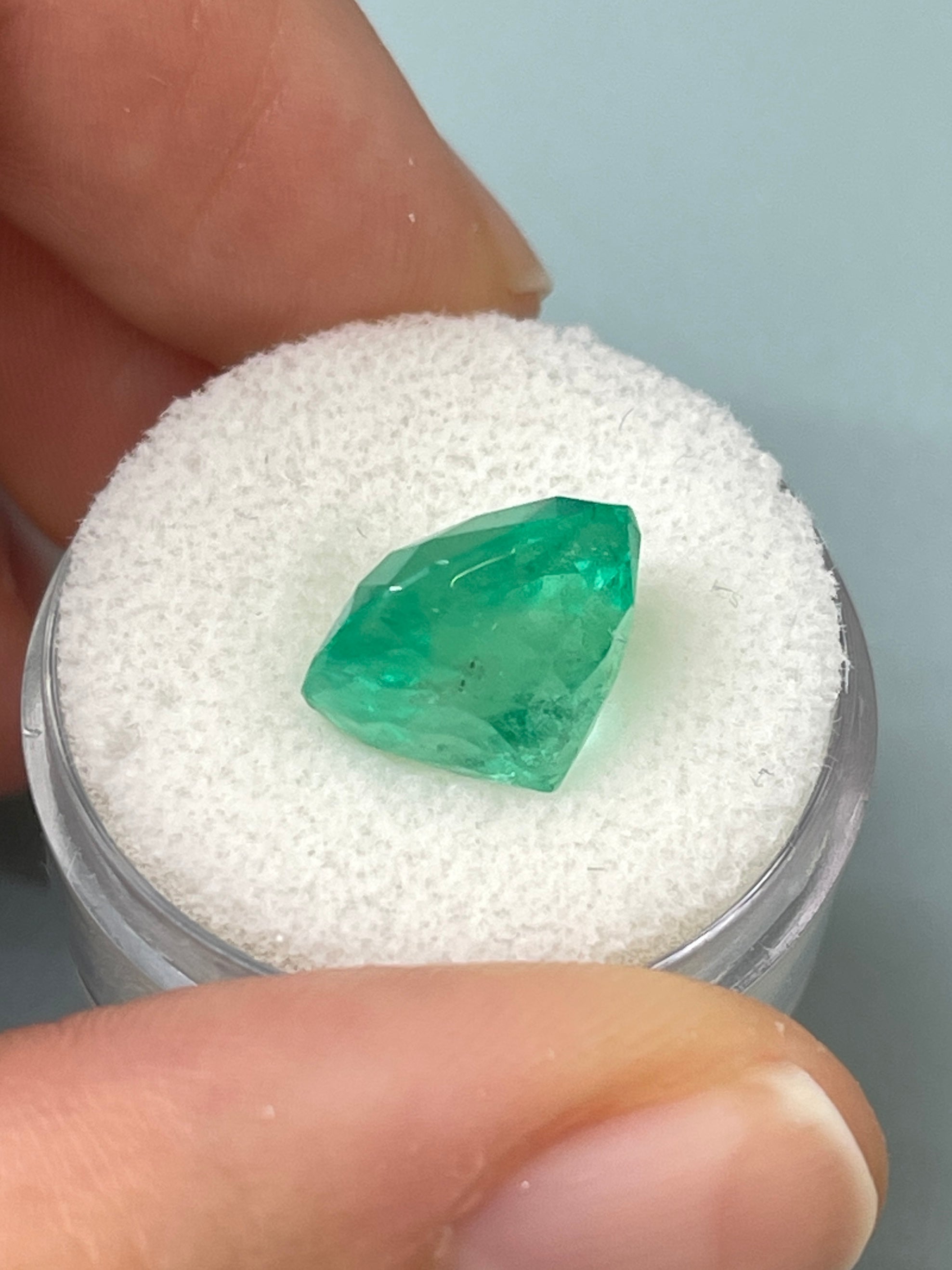 7.28 carat medium bluish green Colombian emerald in cushion cut, natural loose gemstone from JR Colombian Emeralds.