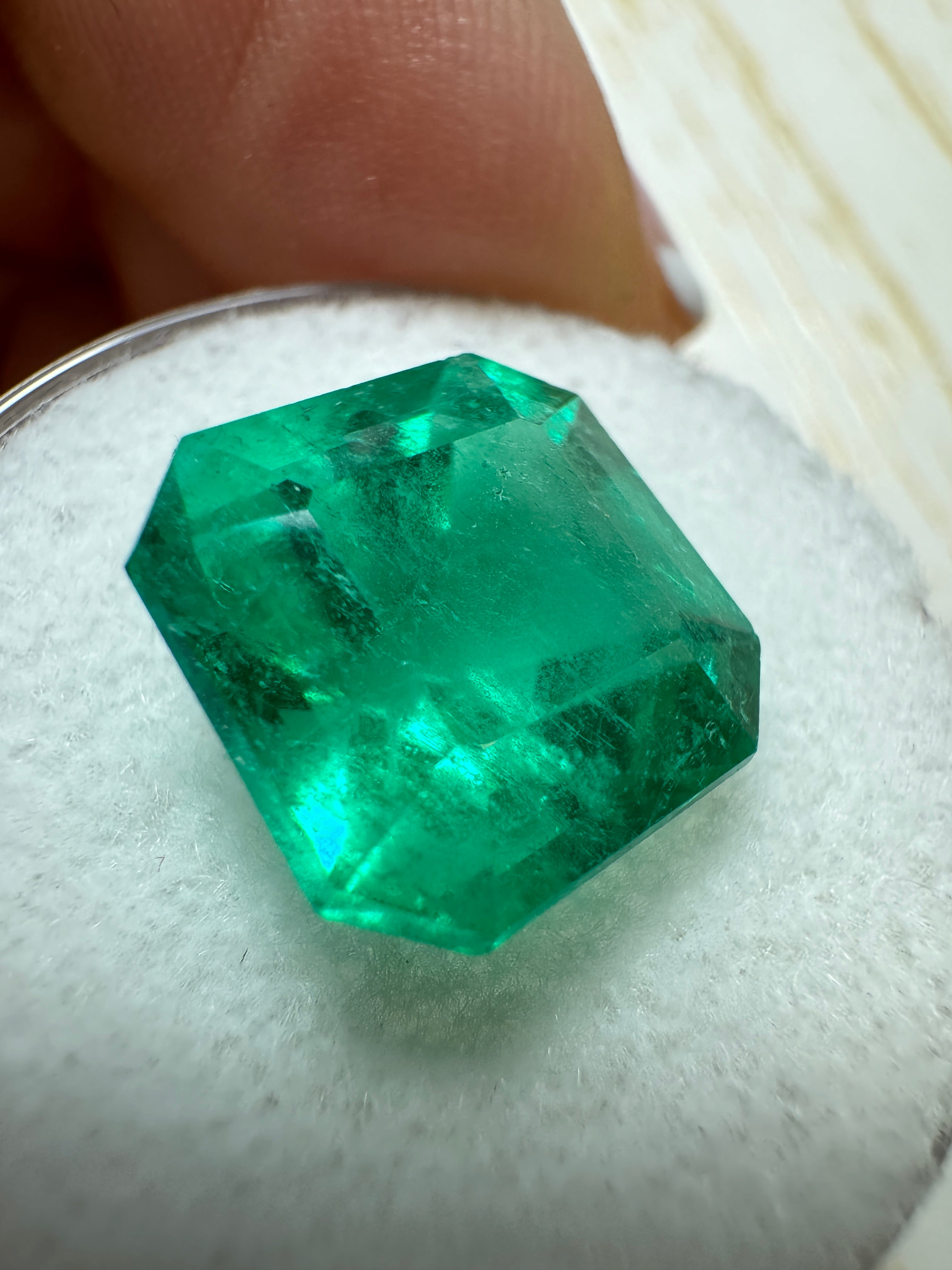 7.38-carat intense bluish-green natural Colombian emerald Asscher cut gemstone from JR Colombian Emeralds.