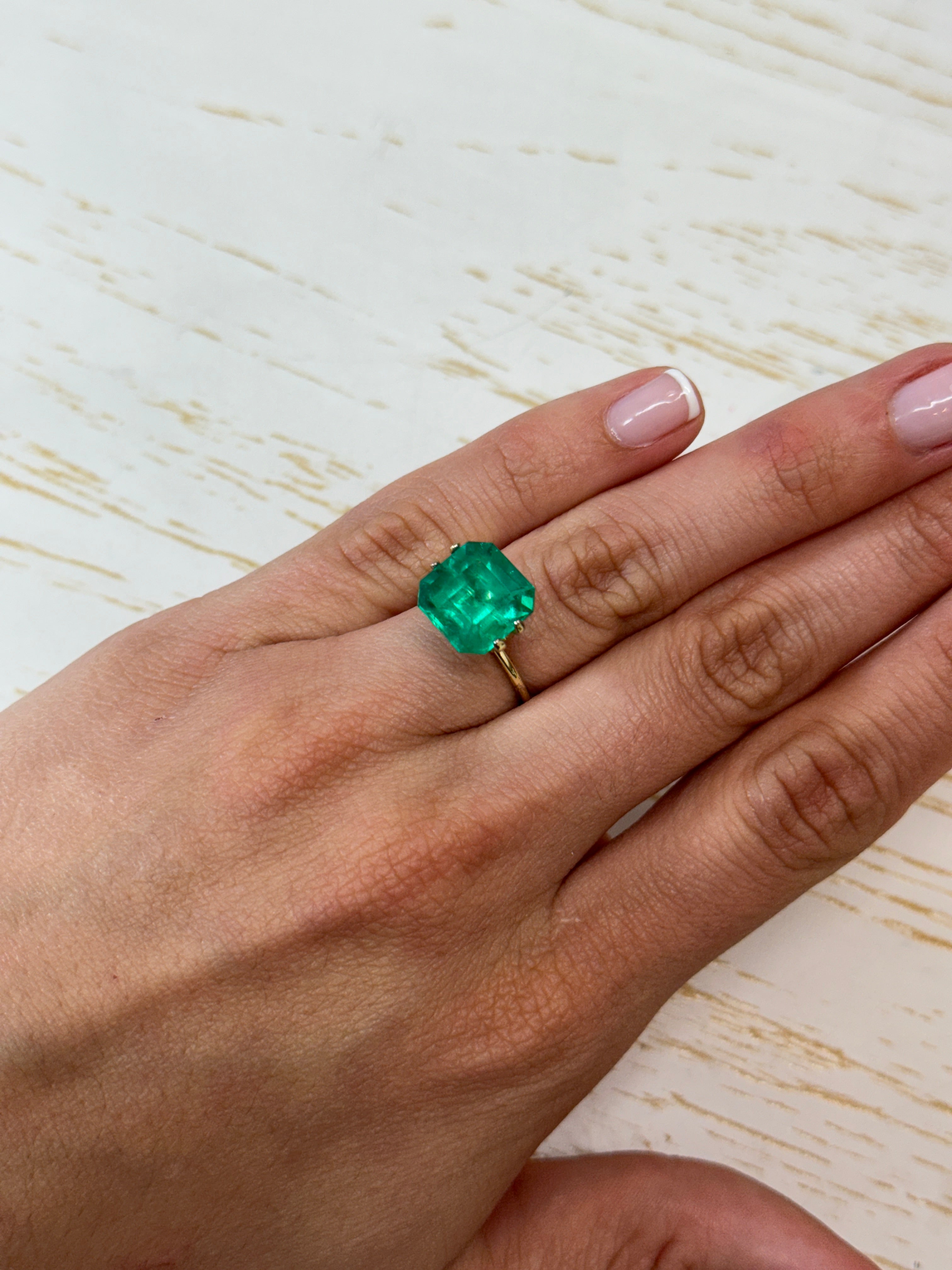 7.38 carat intense bluish green Colombian emerald loose stone with Asscher cut, natural and radiant from JR Colombian Emeralds.