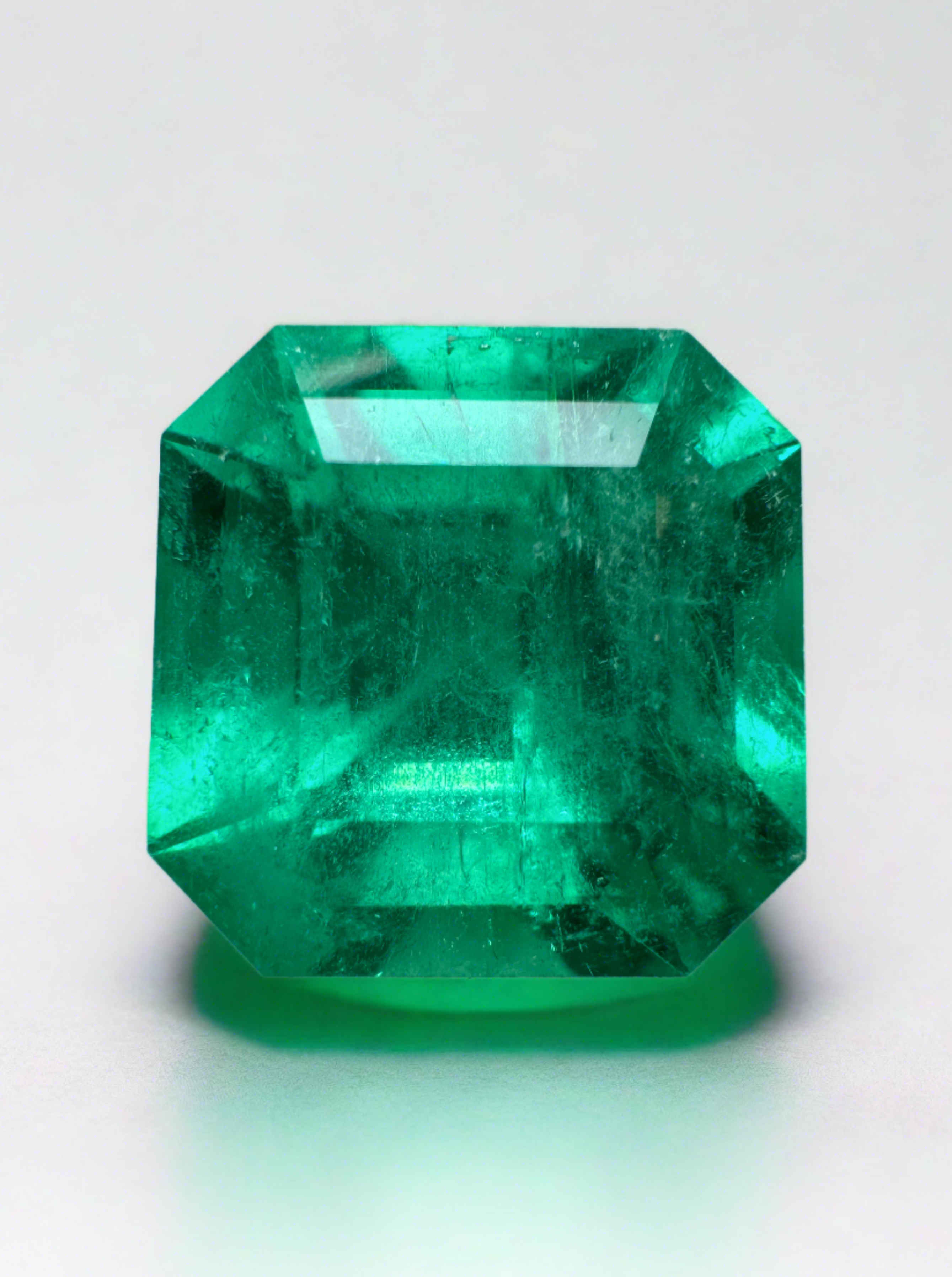 7.38-carat intense bluish green Colombian emerald loose Asscher cut gemstone from JR Colombian Emeralds.