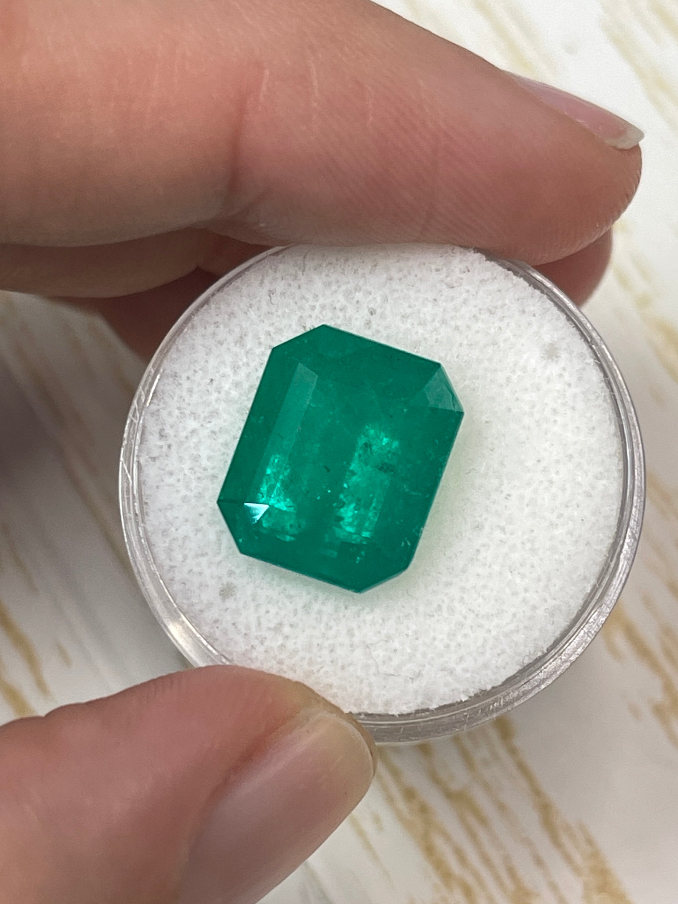 Deep forest green 7.51 carat Colombian emerald cut loose gemstone from JR Colombian Emeralds, showcasing vibrant color and clarity.