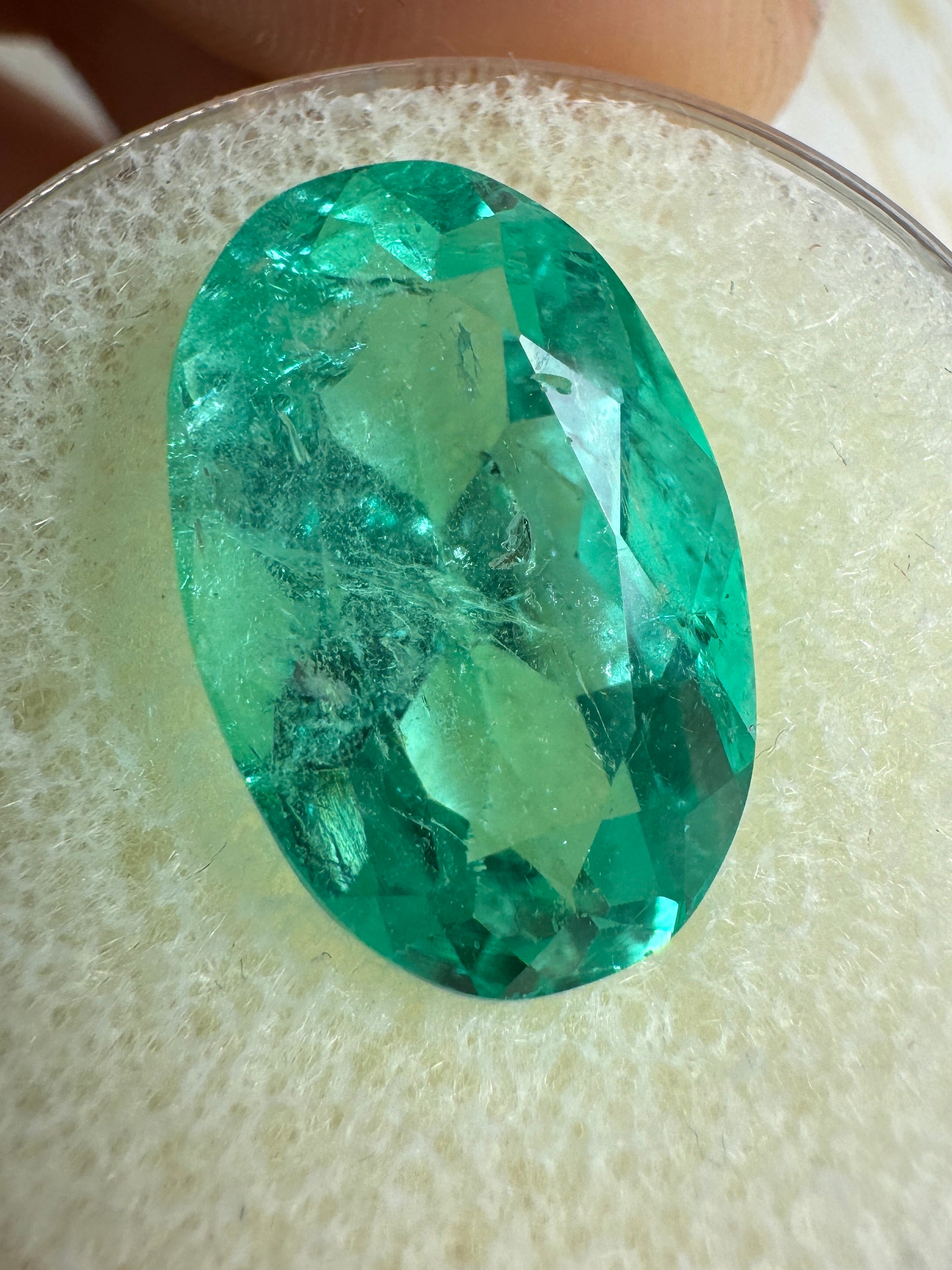 7.55-carat elongated oval Colombian emerald with bluish-green hue, natural loose gemstone from JR Colombian Emeralds.