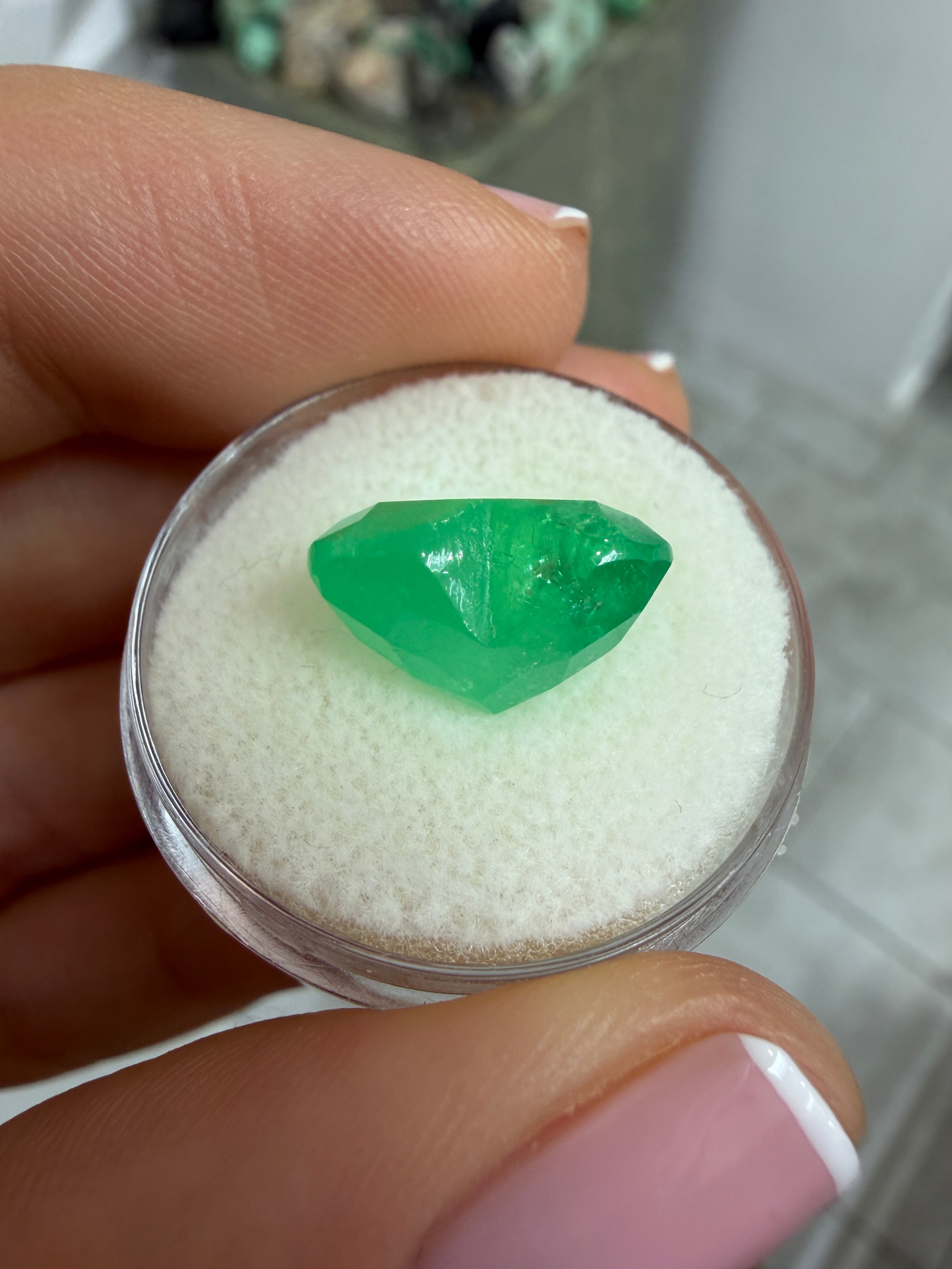 7.68 carat natural Colombian emerald in heart cut with earthy green hue, loose gemstone from JR Colombian Emeralds.