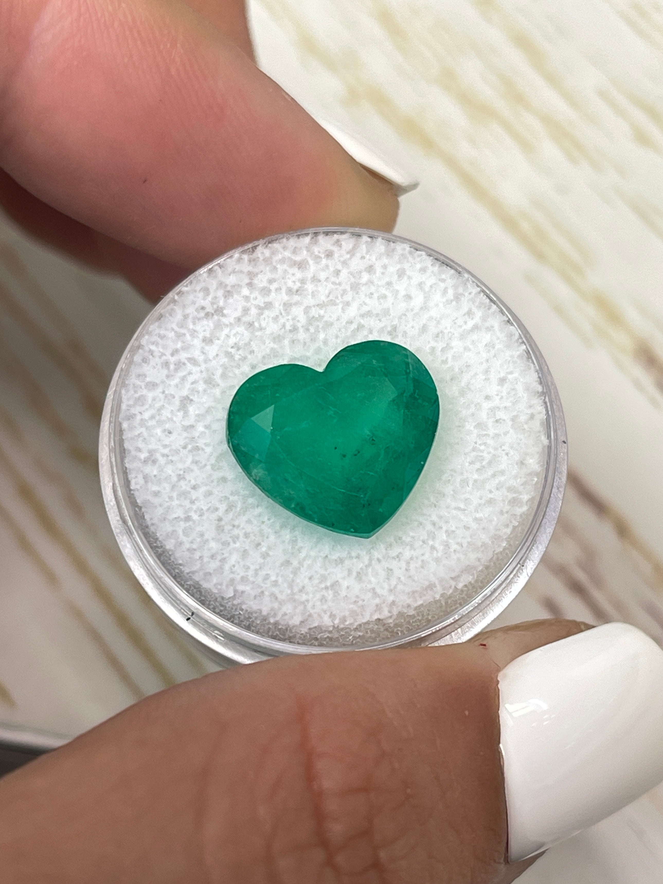 Natural 7.68 carat forest green Colombian emerald loose heart cut gemstone from JR Colombian Emeralds.