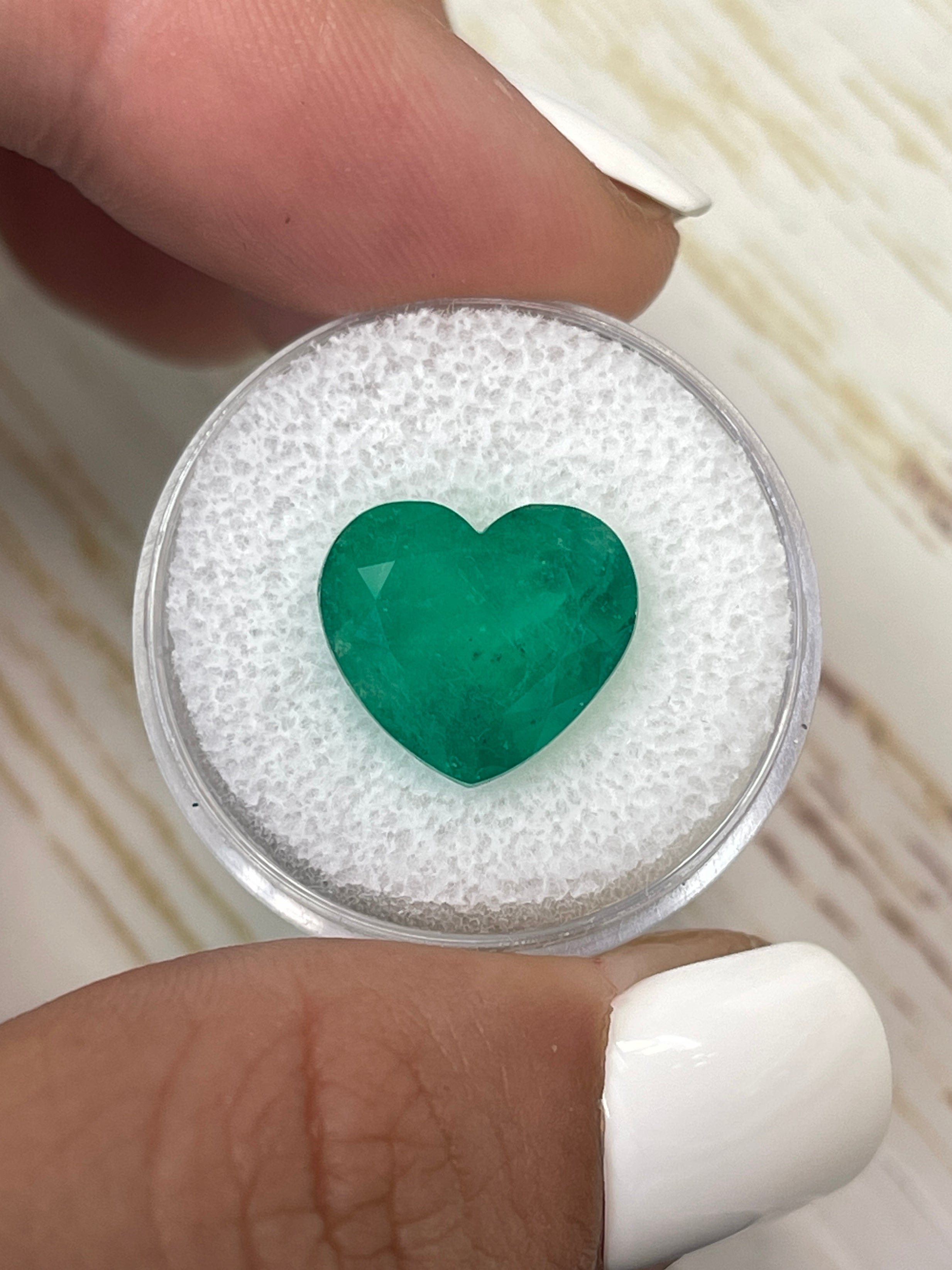 7.68 carat forest green Colombian emerald loose heart-shaped cut gemstone by JR Colombian Emeralds