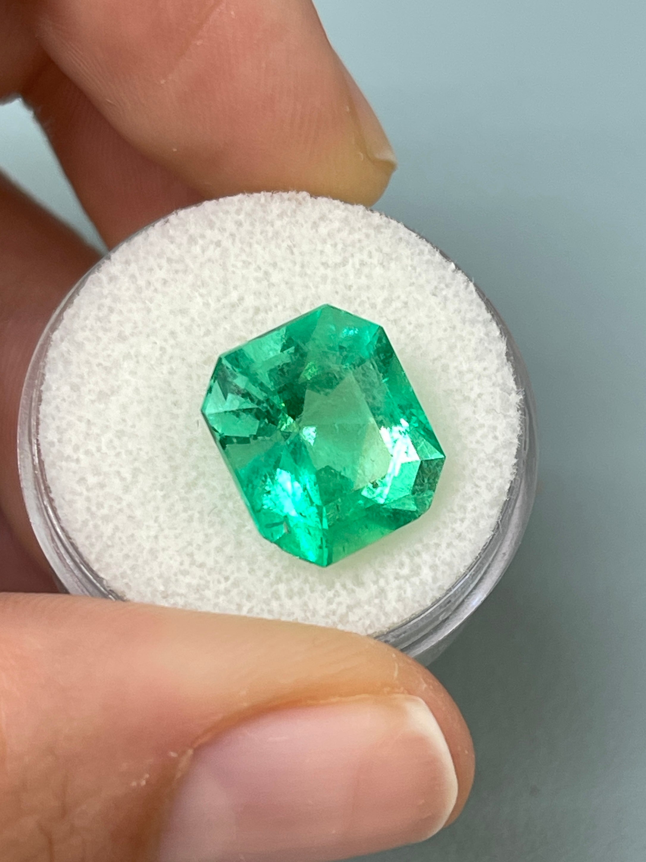 7.92 carat Colombian emerald cut loose emerald from JR Colombian Emeralds, showcasing a chunky 13x11.5 mm emerald gemstone.