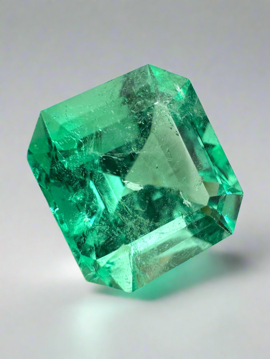 Lusterous 8.01 carat natural Colombian emerald loose gemstone, Asscher cut, vibrant green color, from JR Colombian Emeralds.