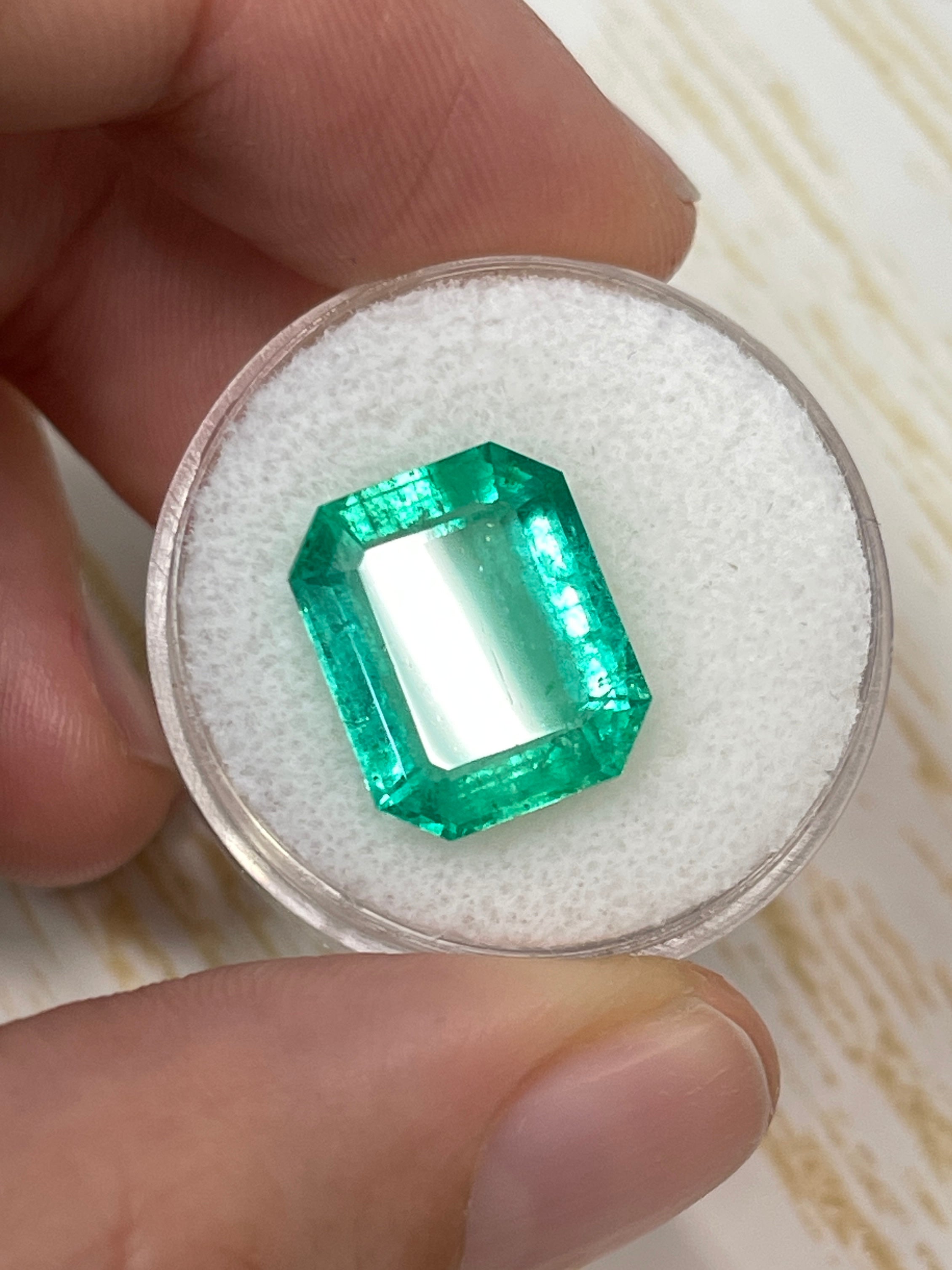 8.20 carat medium green Colombian emerald cut loose gemstone from JR Colombian Emeralds, showcasing vibrant color and clarity.