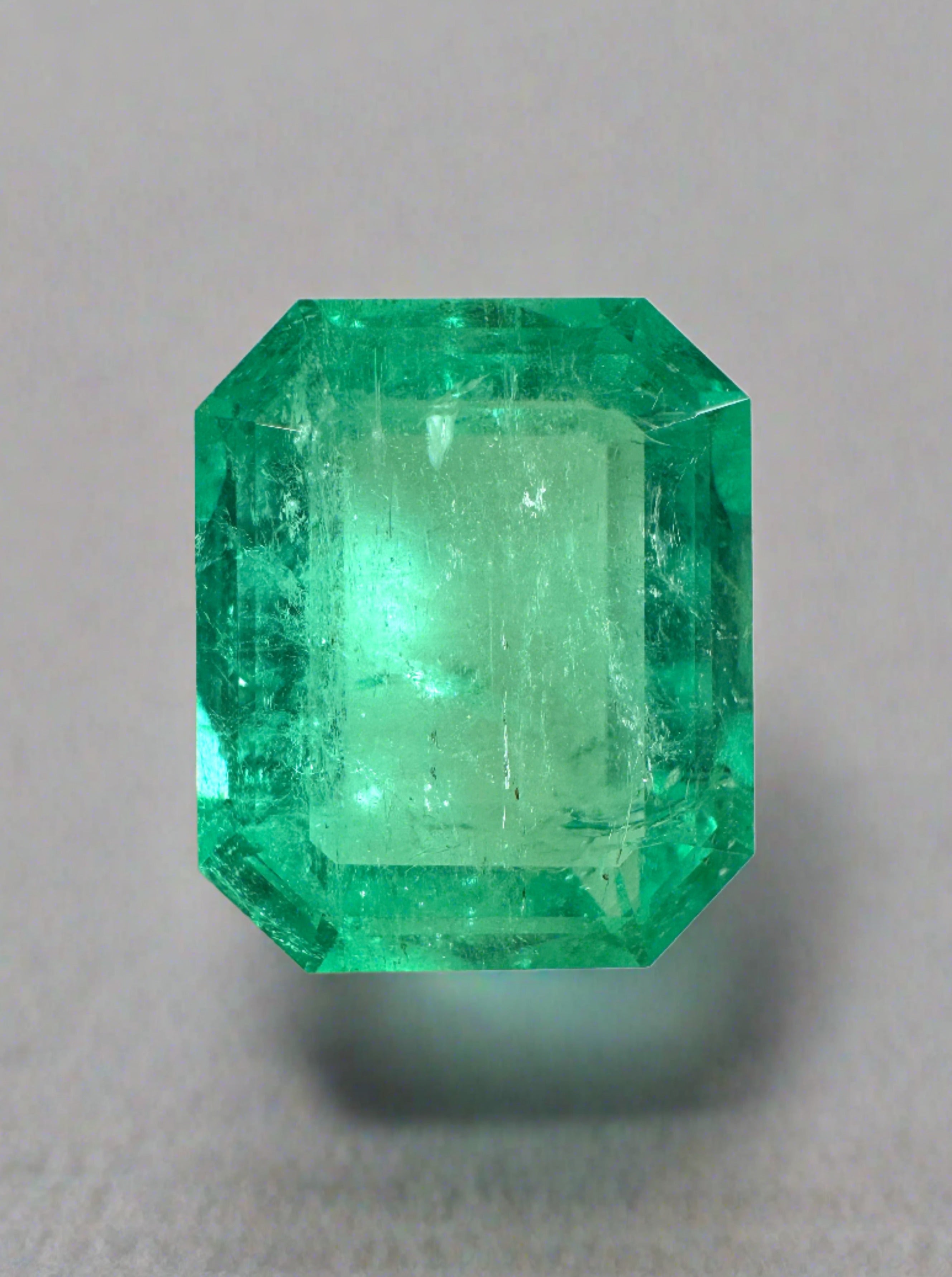 8.20 carat medium green Colombian emerald cut loose gemstone from JR Colombian Emeralds, showcasing vibrant clarity and color.