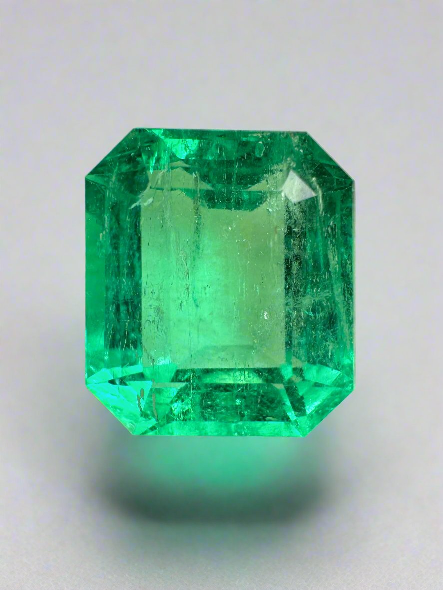 8.33 carat crystal clear emerald cut Colombian emerald loose gemstone from JR Colombian Emeralds, showcasing vibrant green color.