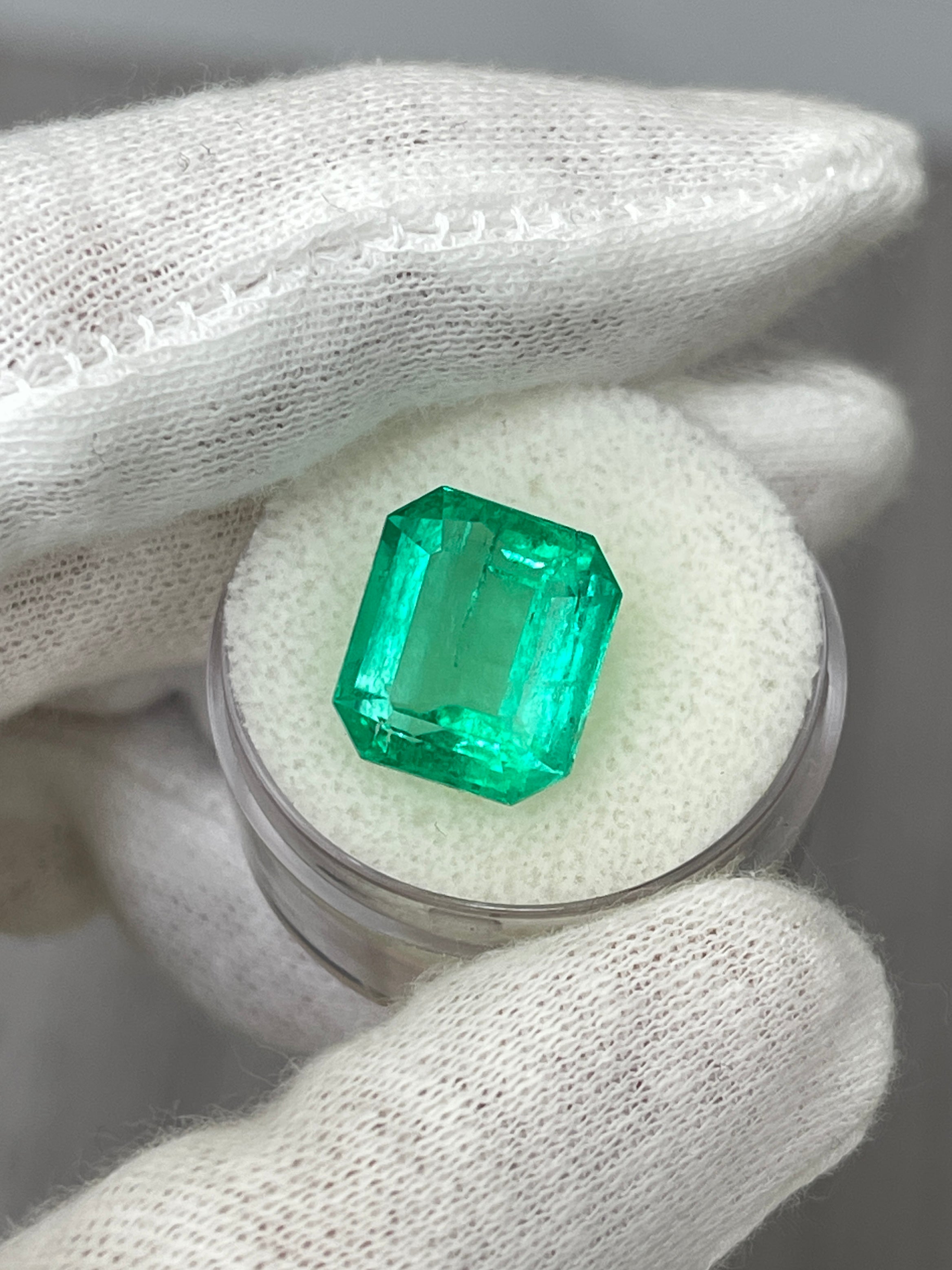 8.33 carat crystal-clear Colombian emerald cut loose emerald from JR Colombian Emeralds, showcasing vibrant green gemstone.