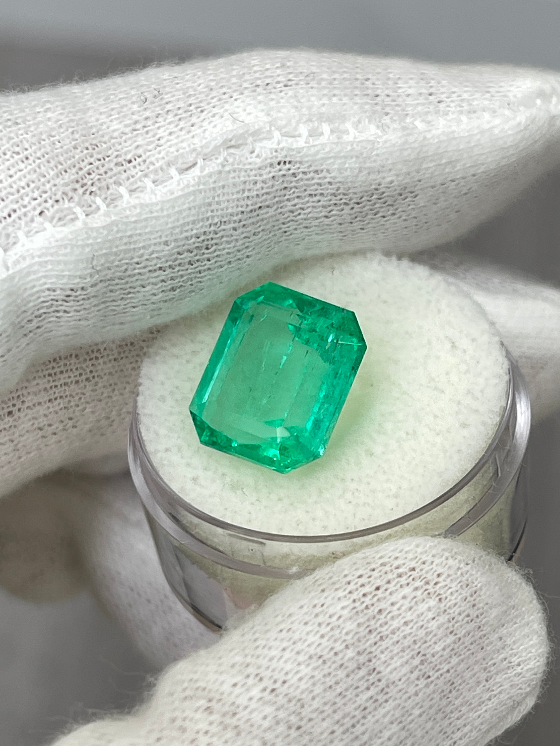 8.33 carat Colombian emerald cut loose emerald from JR Colombian Emeralds, showcasing crystal-clear, vibrant green gemstone.