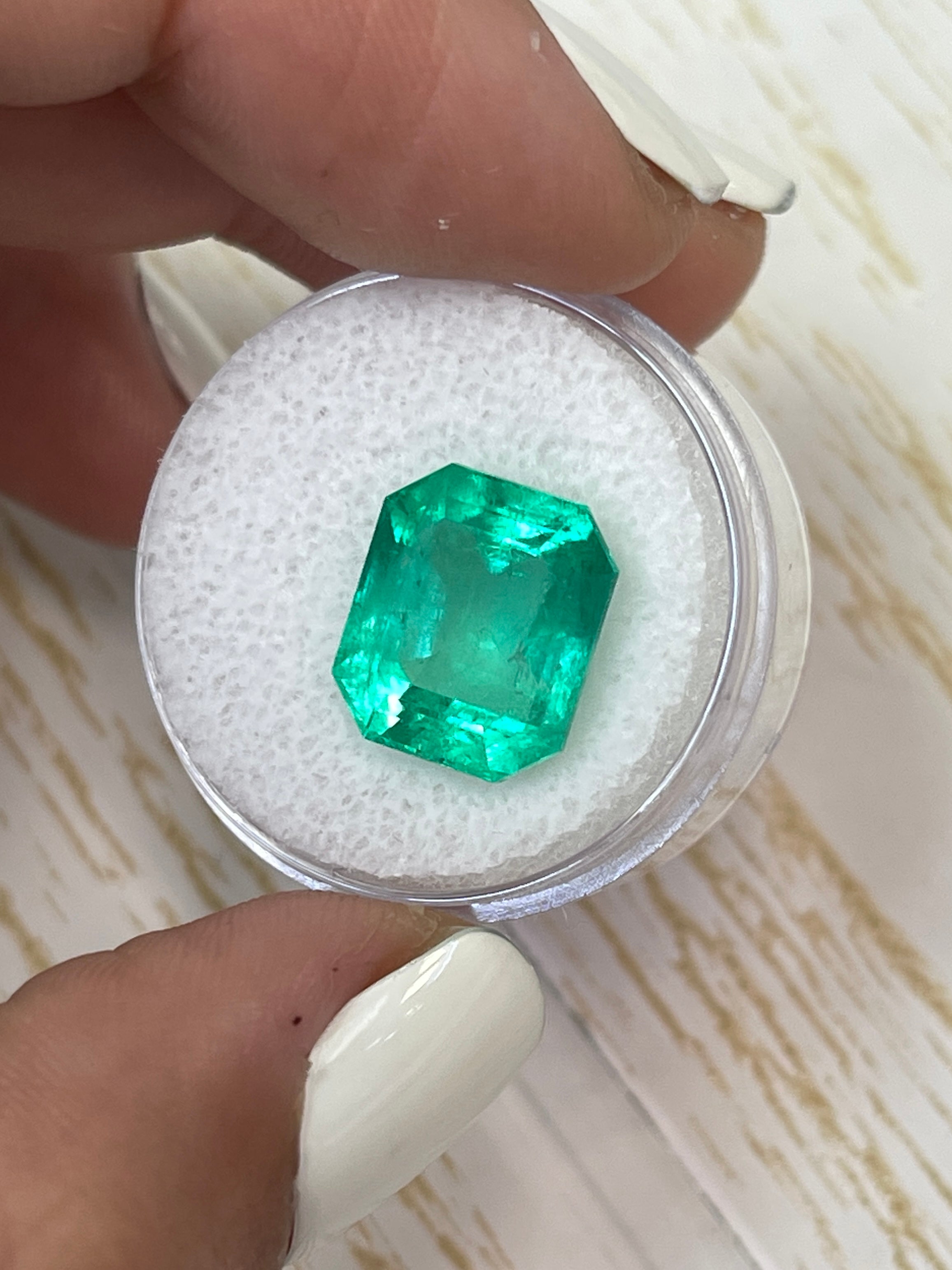 8.51 carat Colombian emerald cut loose emerald from JR Colombian Emeralds, showcasing a classic 13x11mm emerald-cut gemstone.