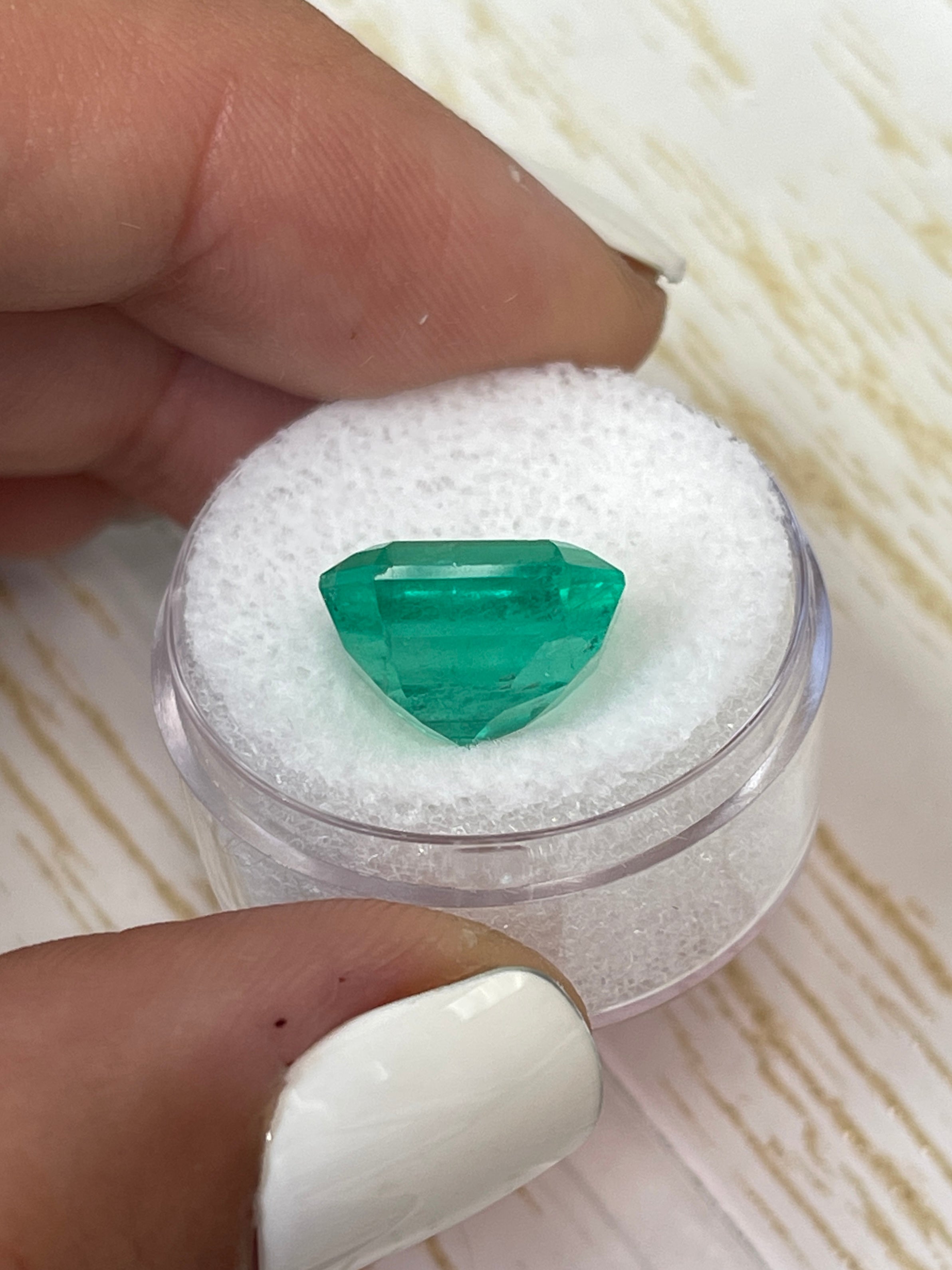 8.51 carat Colombian emerald cut loose emerald from JR Colombian Emeralds, showcasing a vibrant, clear emerald gemstone with a classic cut.