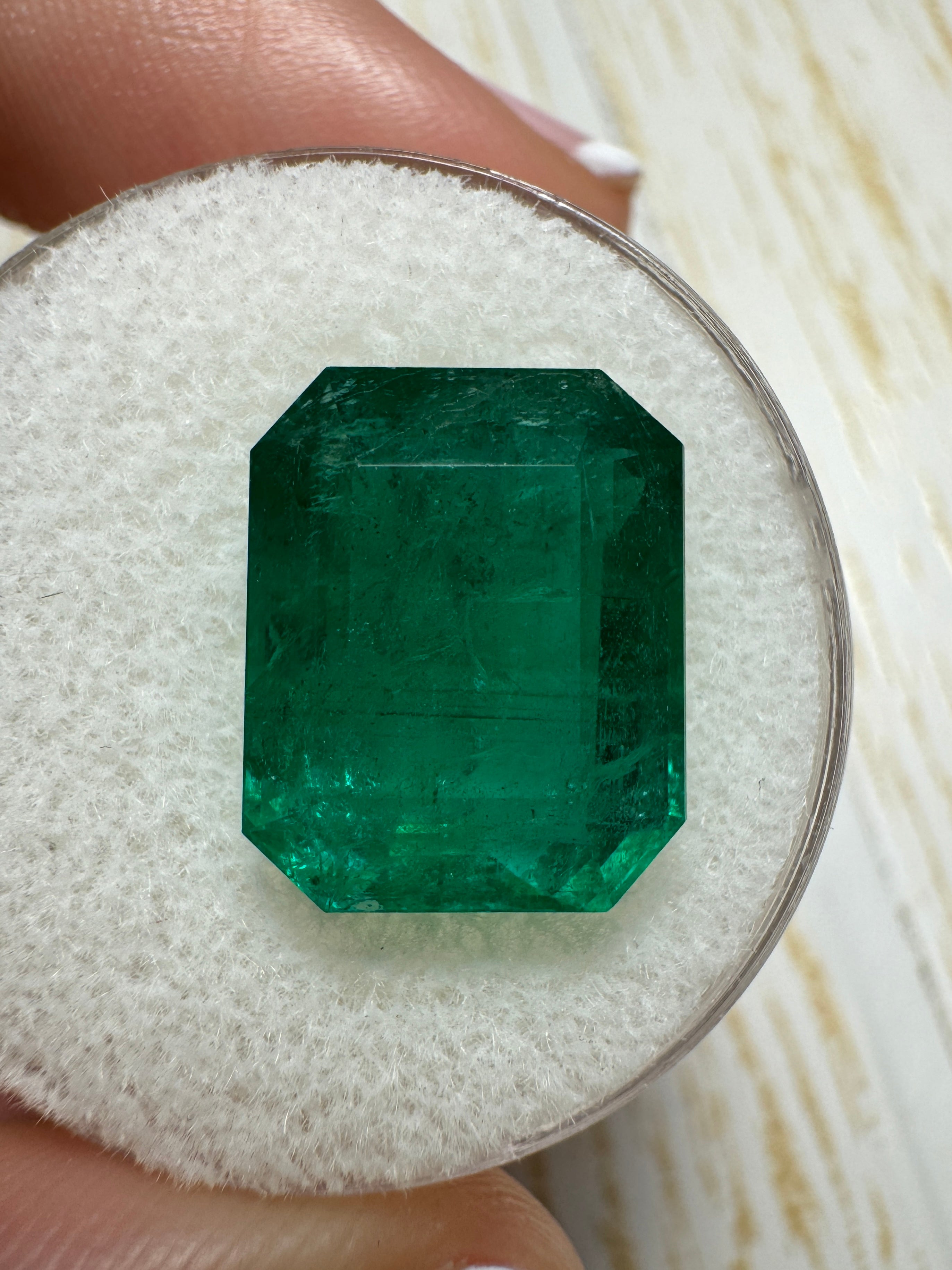 Deep green 8.60 carat Zambian emerald cut loose emerald from JR Colombian Emeralds, showcasing its vibrant color and clarity