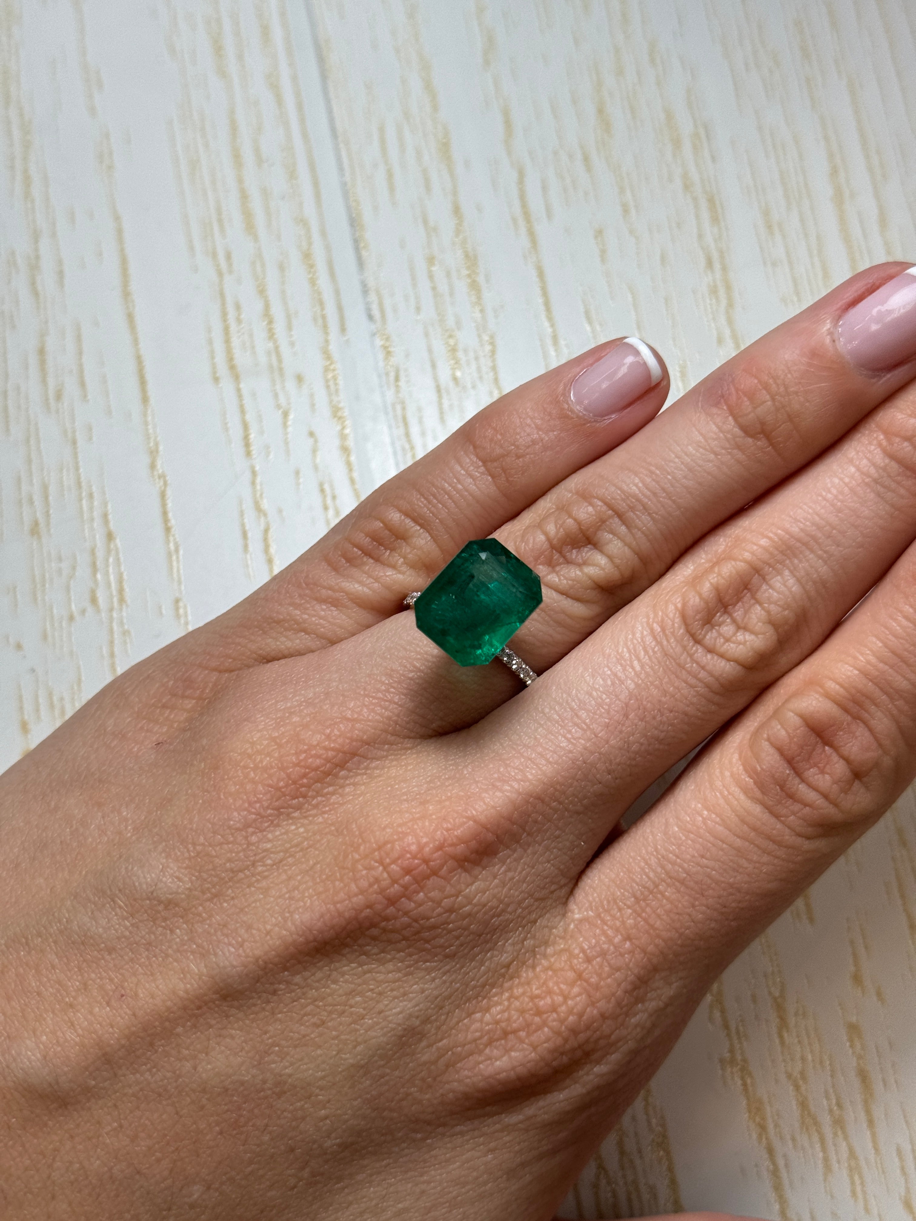 Deep green 8.60 carat Zambian emerald cut loose emerald from JR Colombian Emeralds, 13.5x11 mm gemstone with vibrant color.