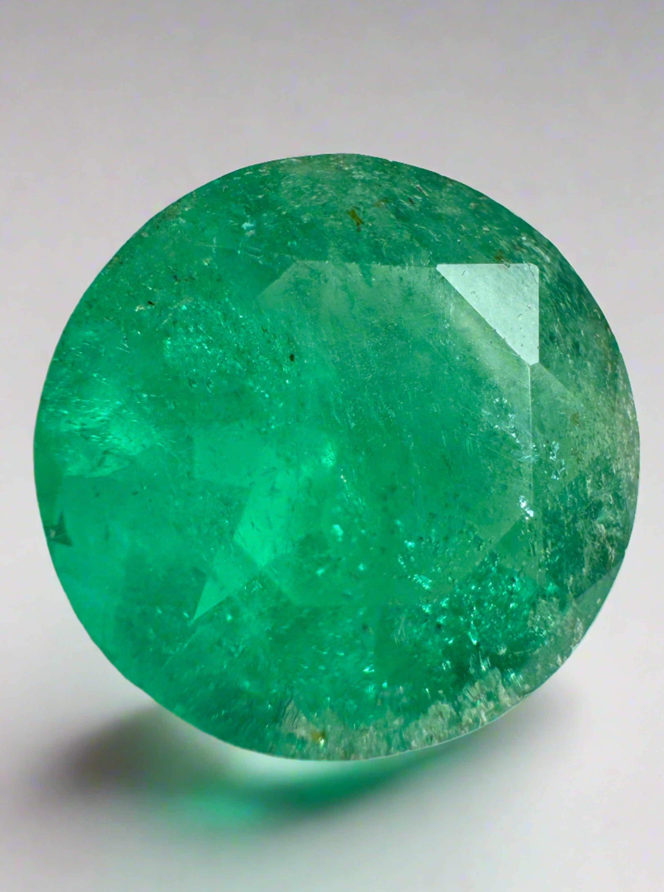 Deep green 8.80 carat round Colombian emerald loose gemstone with natural clarity, from JR Colombian Emeralds.