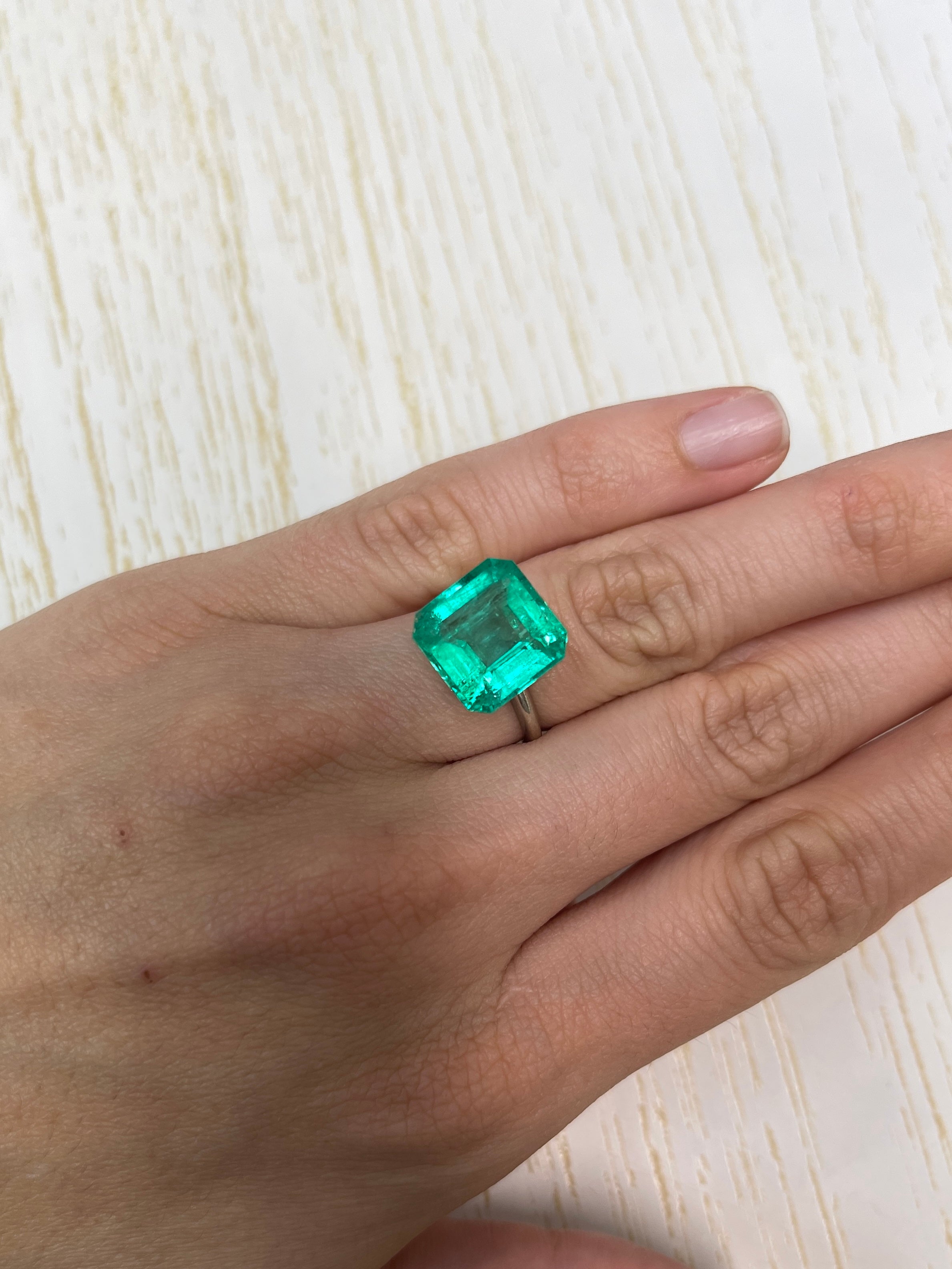 8.81 carat natural Colombian emerald loose gemstone, glowing green Asscher cut, from JR Colombian Emeralds.