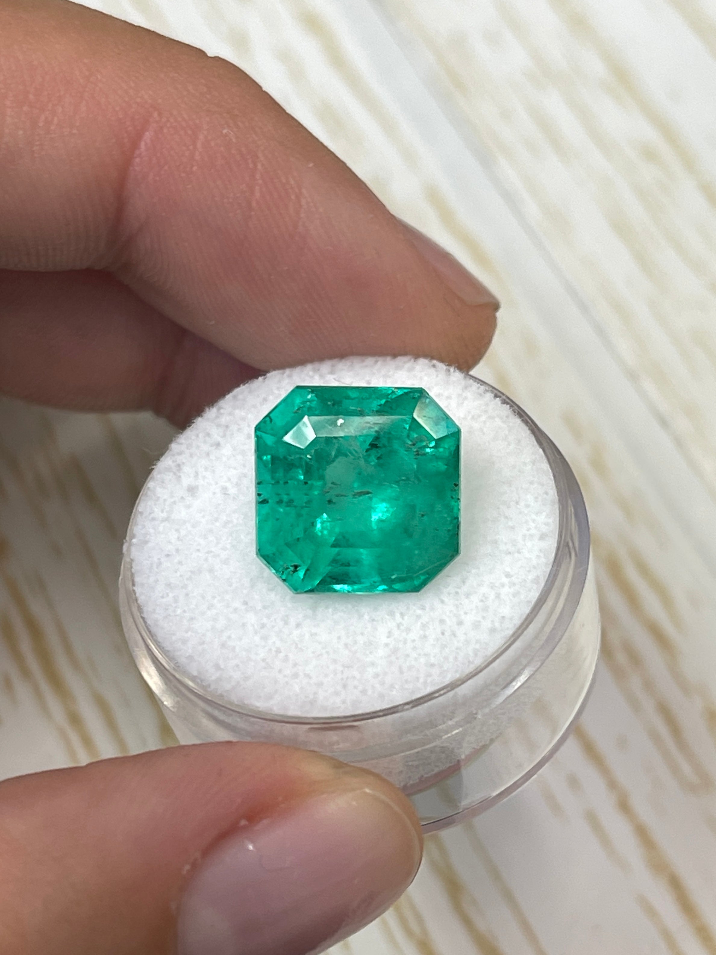 Large 9.03 carat natural Colombian emerald in Asscher cut, vibrant green, loose gemstone from JR Colombian Emeralds.